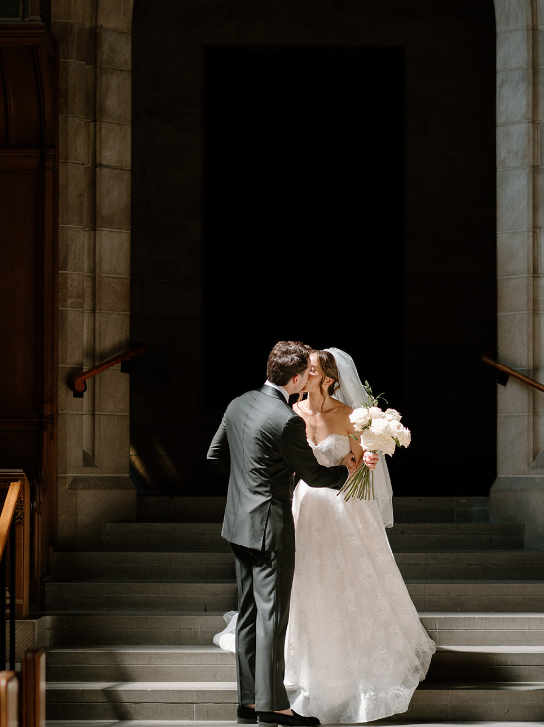 Candlelit tablescape with whimsical white florals at Caffino, styled by Dereves Studio, a Toronto wedding planner and florist creating elevated intimate weddings.
