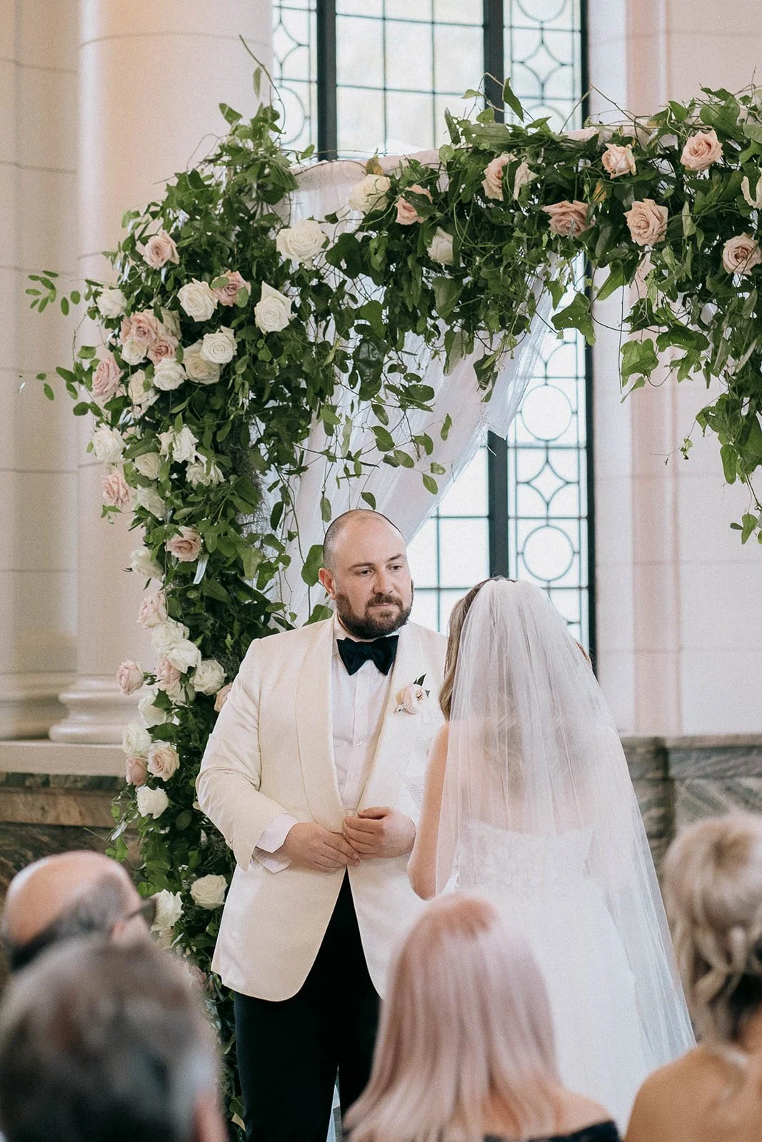 Elegant reception design with full floral centerpieces, glass hurricanes, and heavy candle placements, curated by Dereves Studio to show how to make your wedding look expensive through cohesive luxury wedding design Toronto.