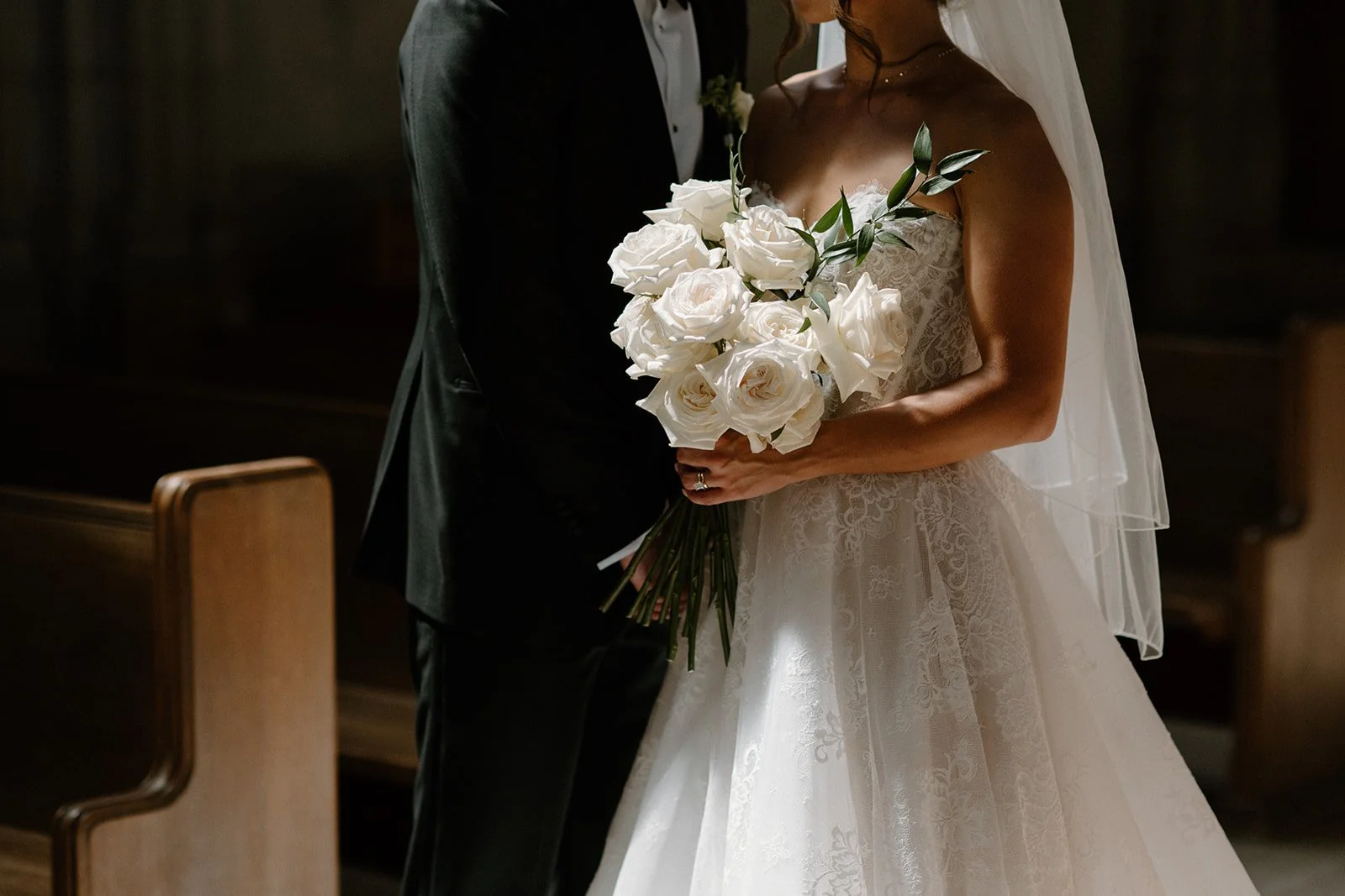 Whimsical white wedding at Caffino in downtown Toronto, designed and coordinated by Dereves Studio with soft florals, candlelit details, and intimate restaurant styling