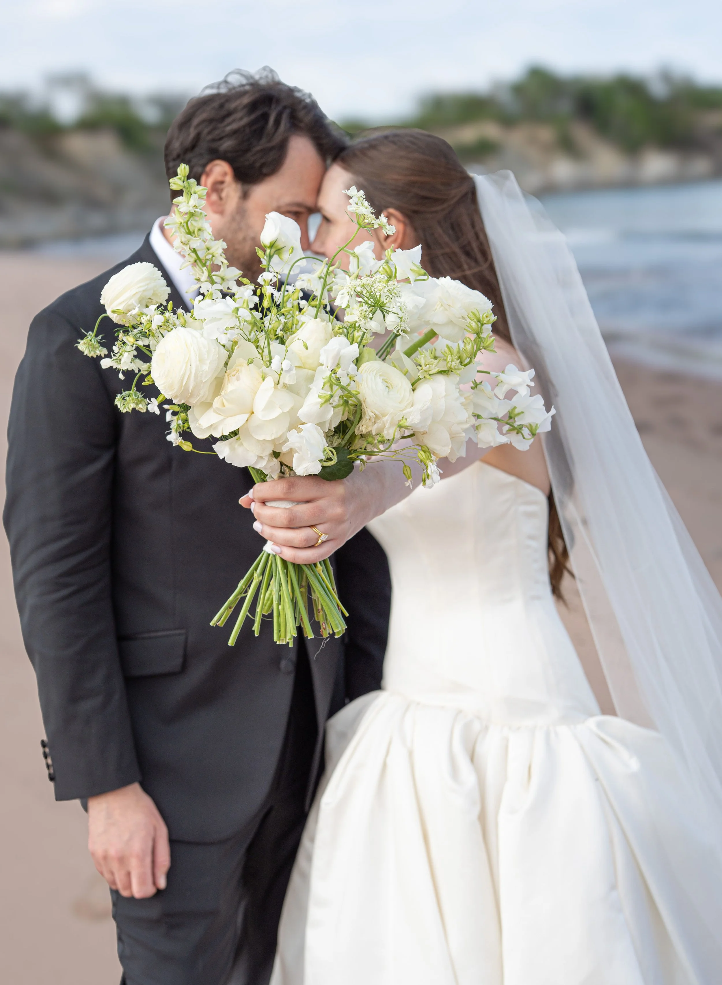 Destination wedding reception in Nova Scotia with modern floral design and candlelit tablescape by Derêves Studio, a Toronto destination wedding planner and florist.