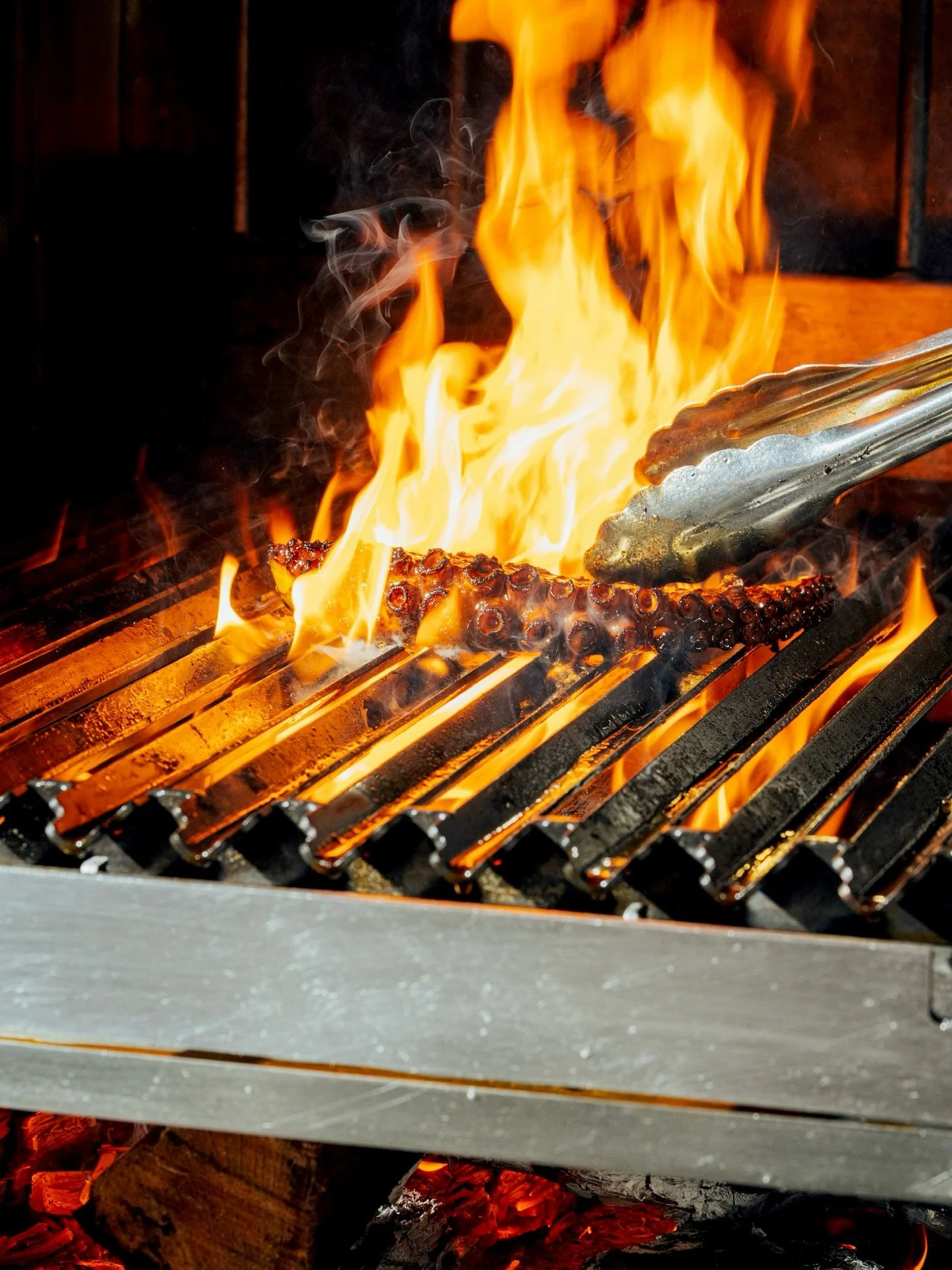 from the sea to the flame.
grilled octopus, deeply charred, finished with lemon.