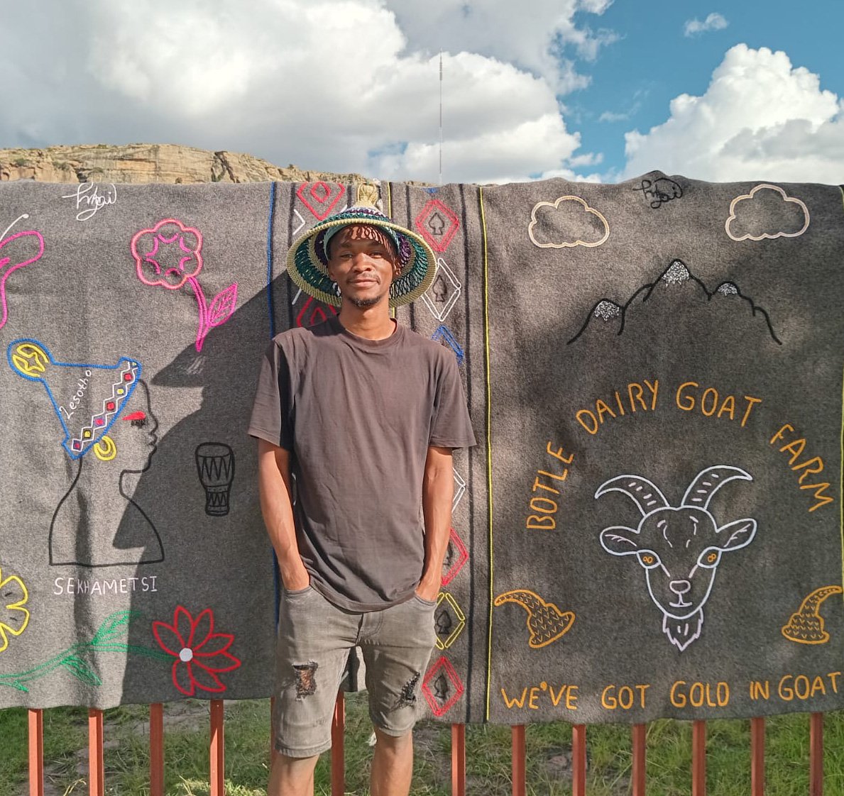 Lesotho artist, William Marapamele. Shepherd and blanket artist shown with his embroidered blankets.