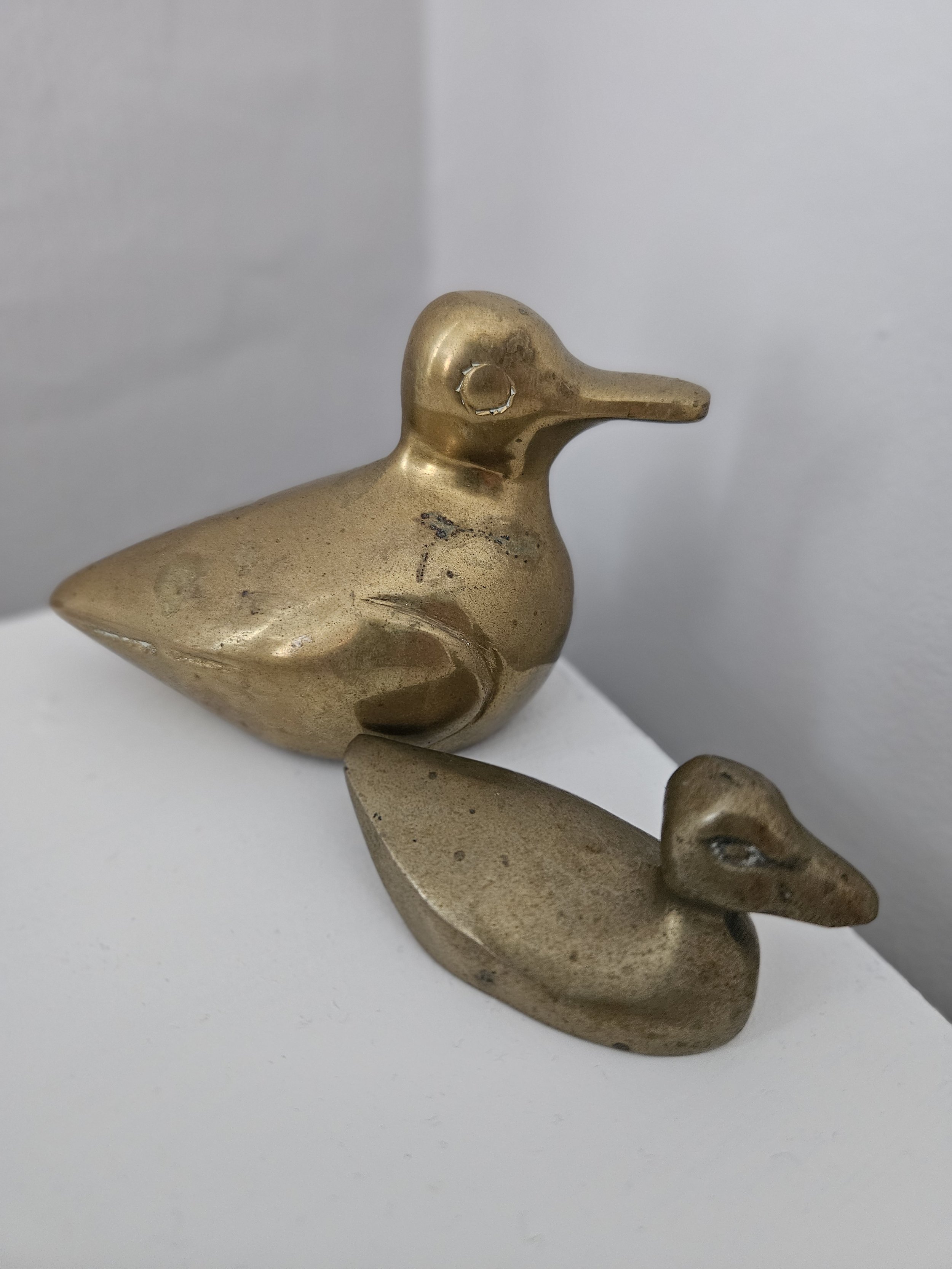 set of two (2) brass ducks