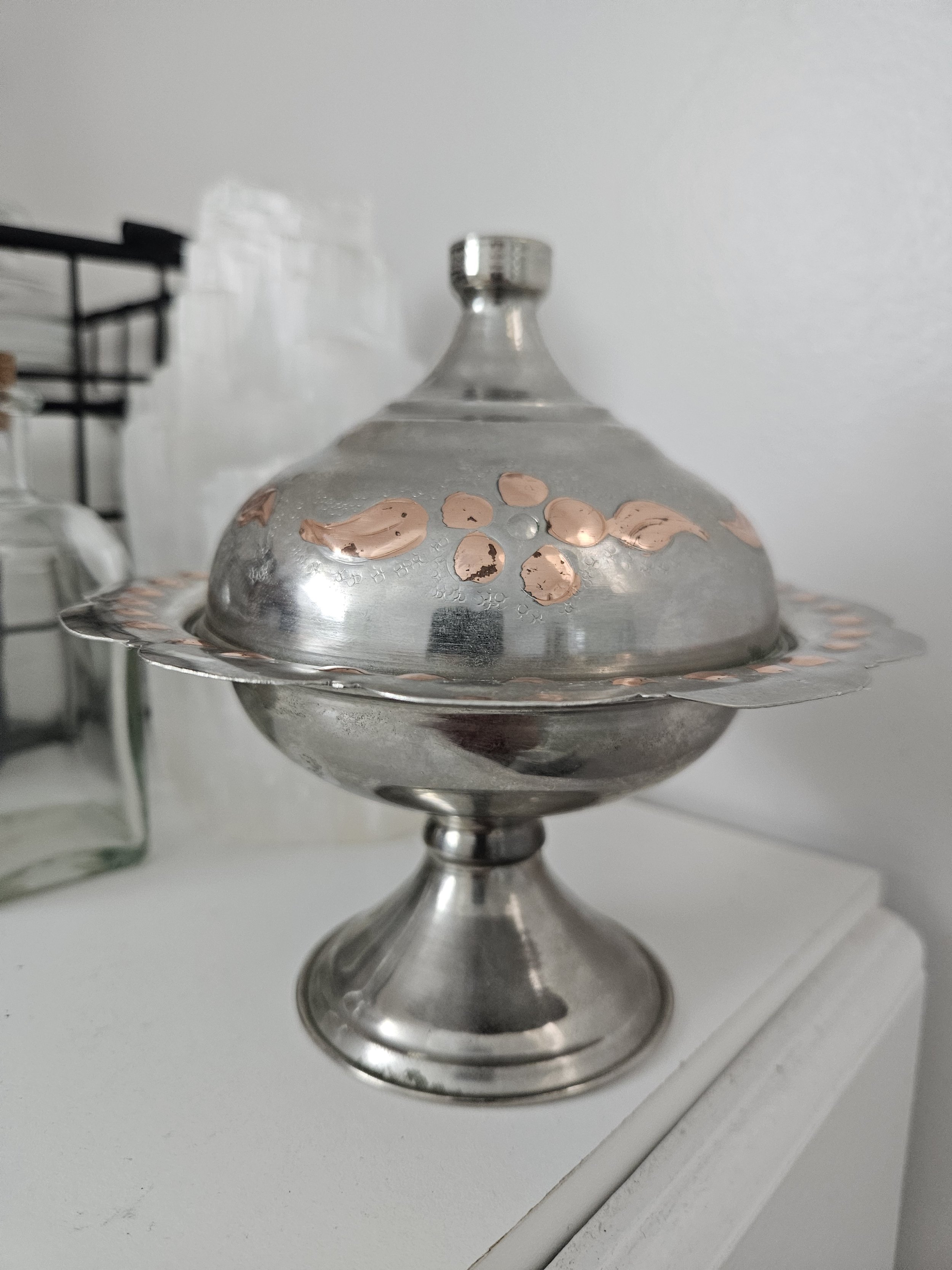 silver and copper covered bowl