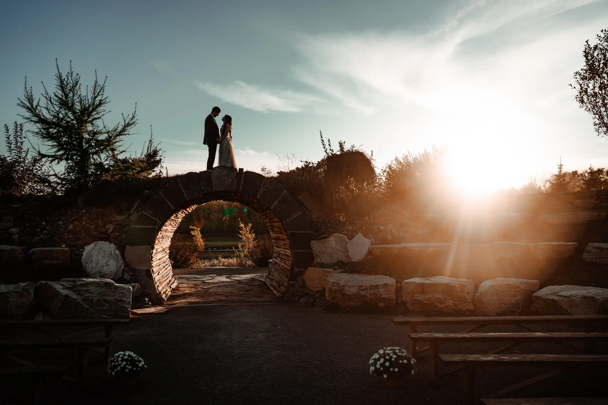 A couple is photographed at sunset on their wedding day at the obsidian ridge tunnel