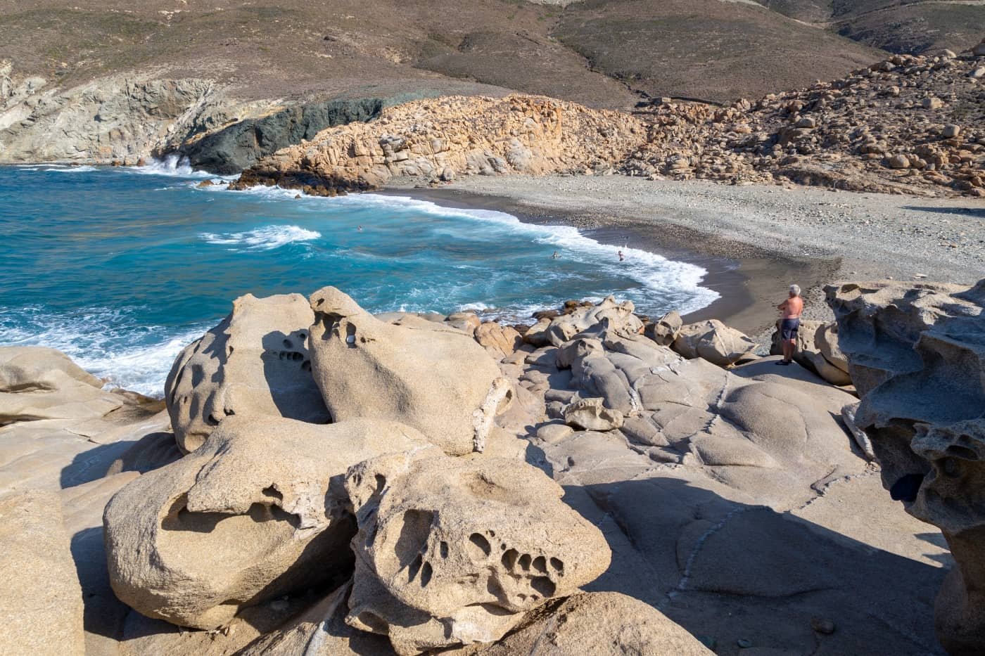 Location 1: Sculpted granite rock formation and crystal-blue waters at Livada