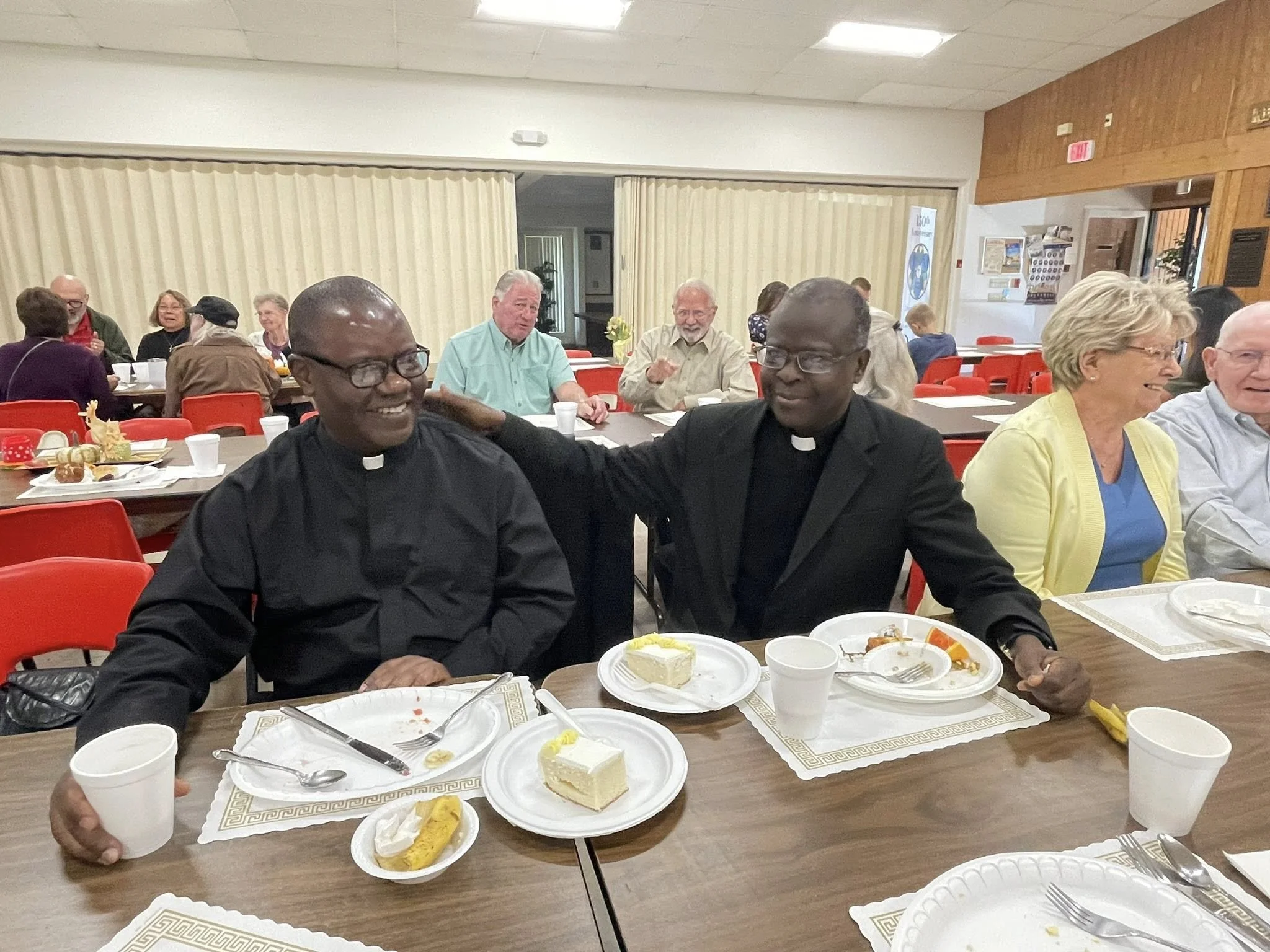 father with friend priest.jpg