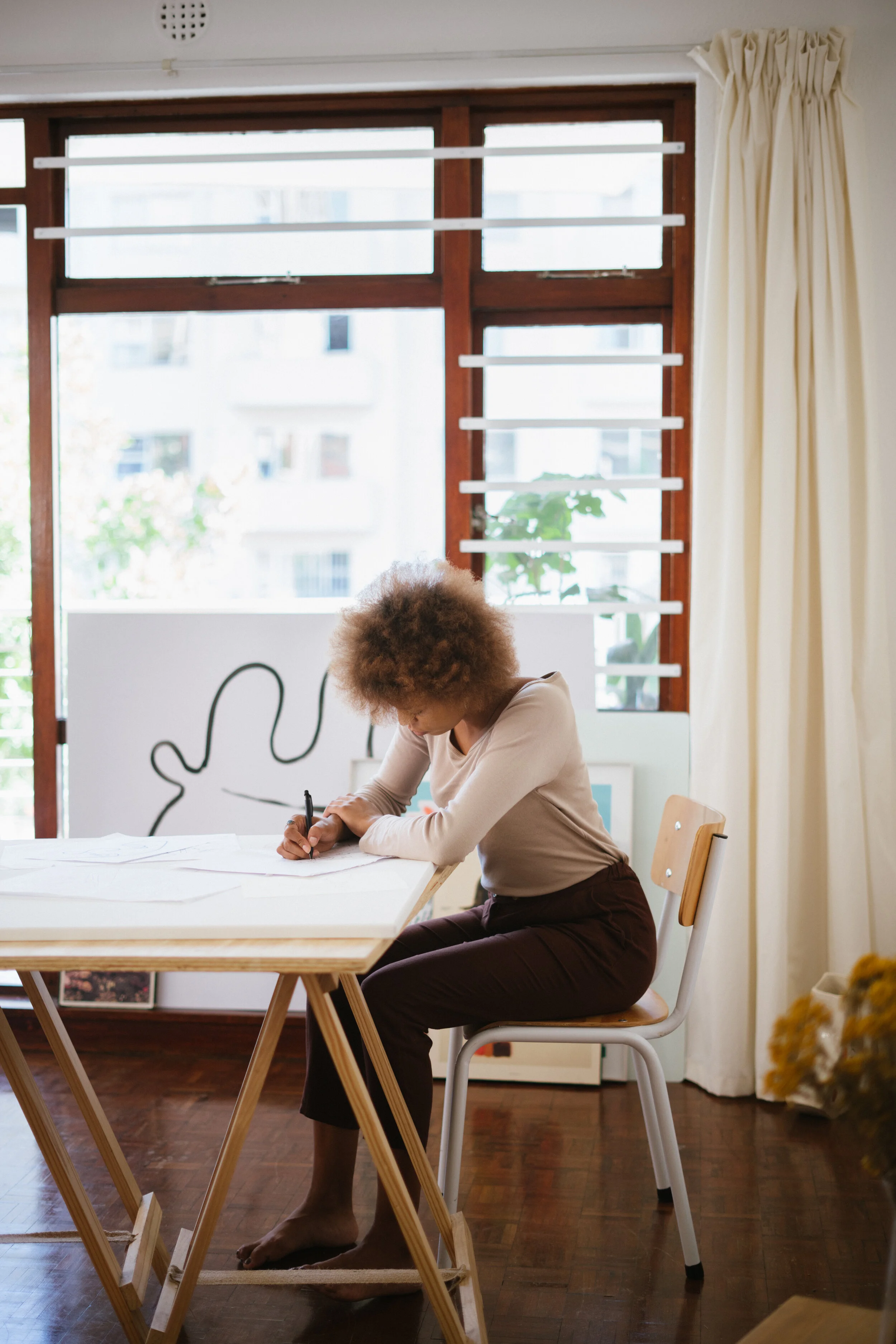 woman-in-brown-long-sleeve-shirt-sitting-on-chair-in-front-3817556.jpg