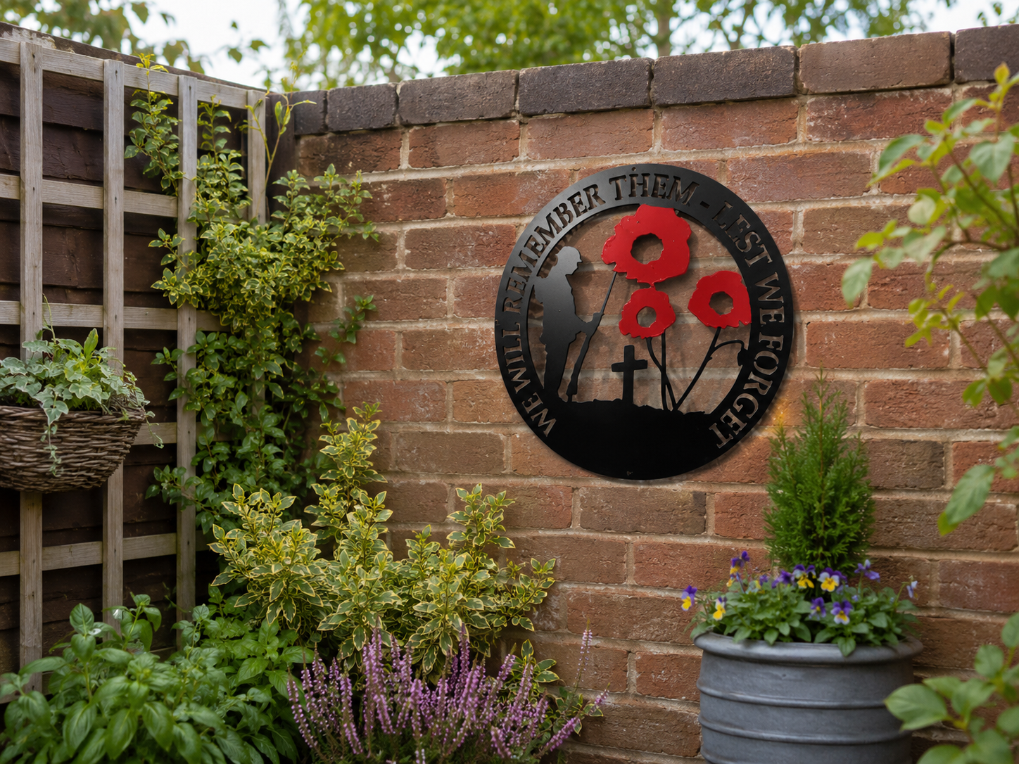 Lest we forget plaque on brick wall.png