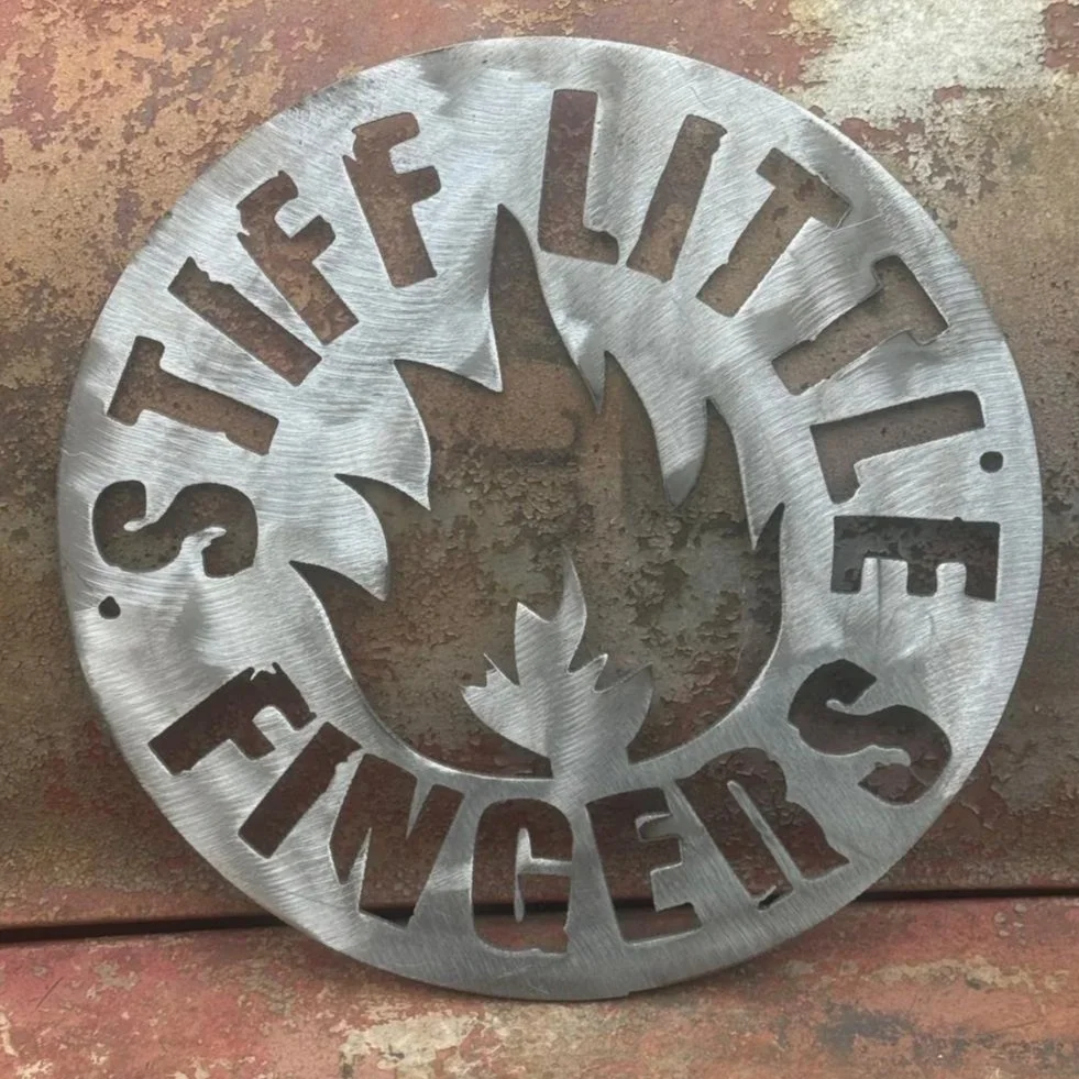 stiff+little+fingers+fire+logo+rusty+background.jpg