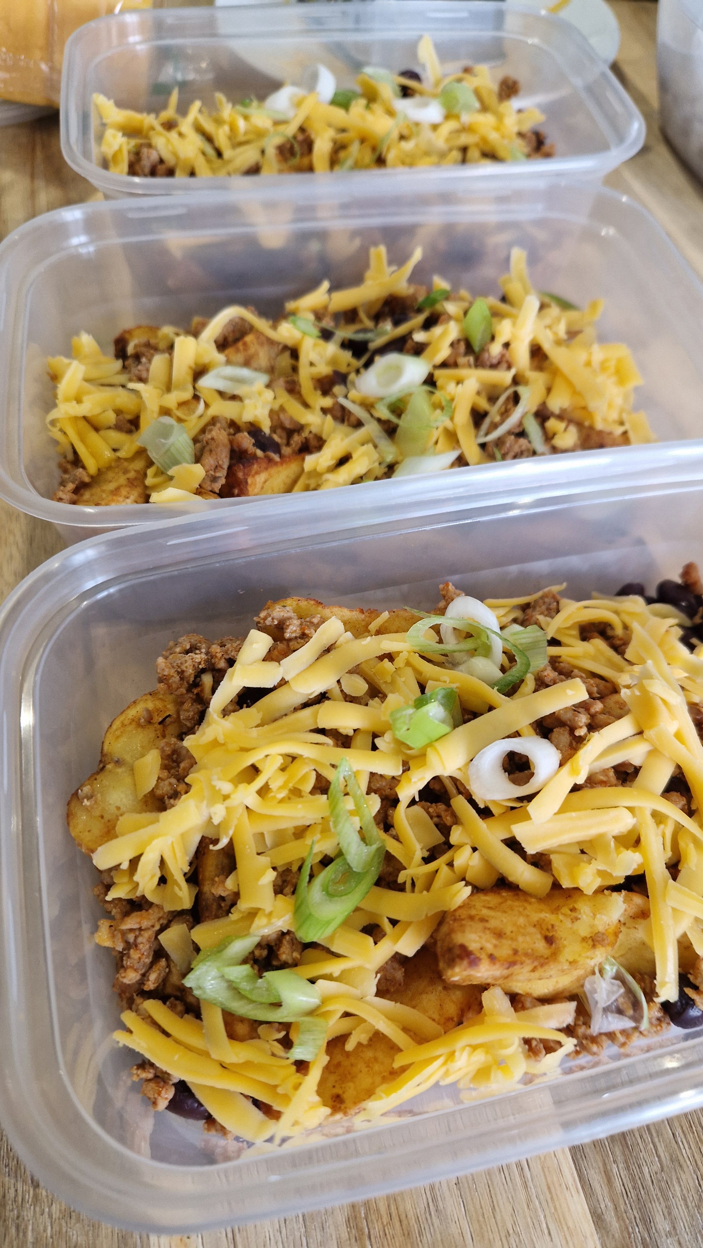Comforting prepared meals with a golden cheese topping.
