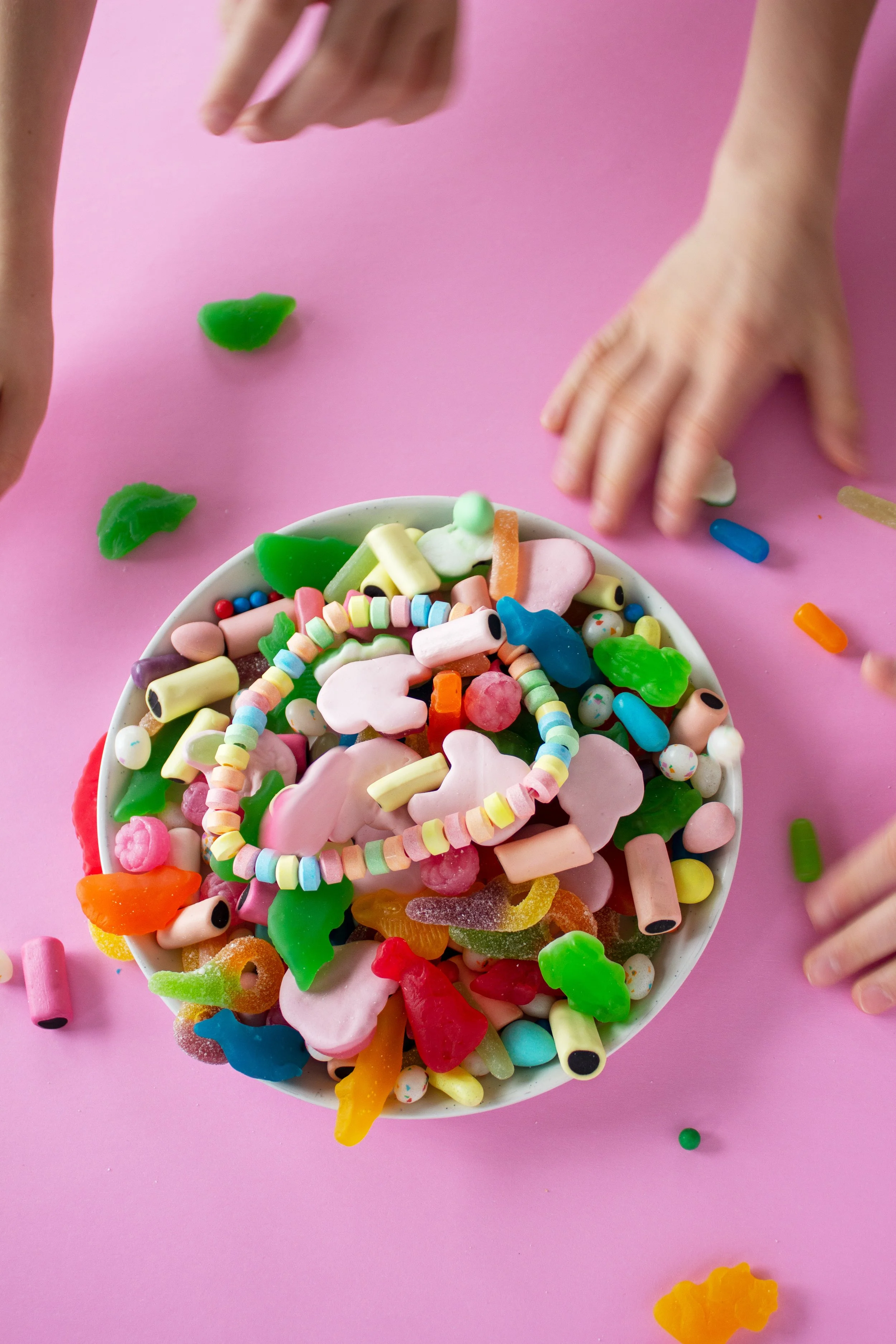 Hands scramble for candy