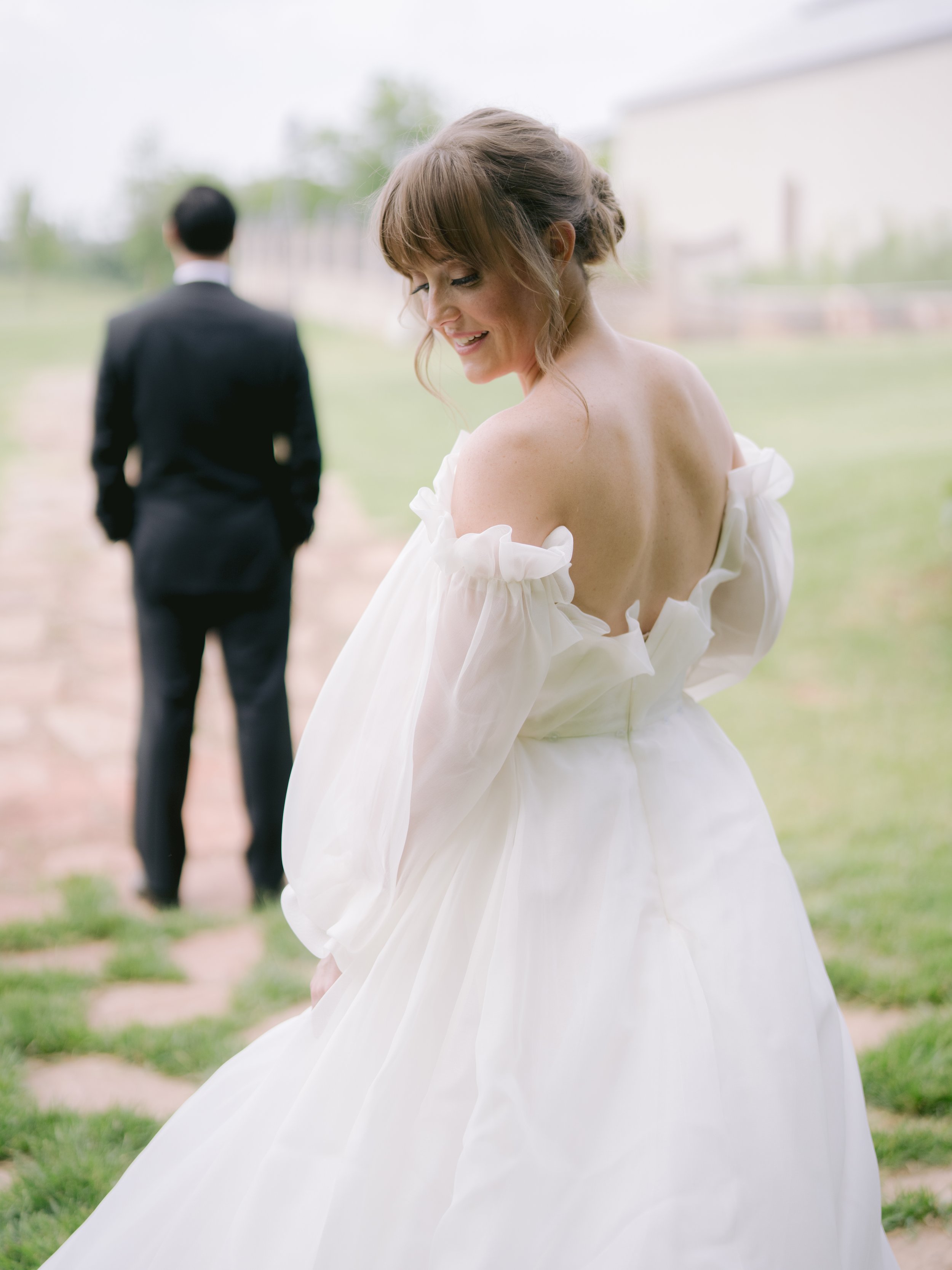 Monique Lhuillier bride about to do first look with groom by luxury wedding photographer Amanda Watson