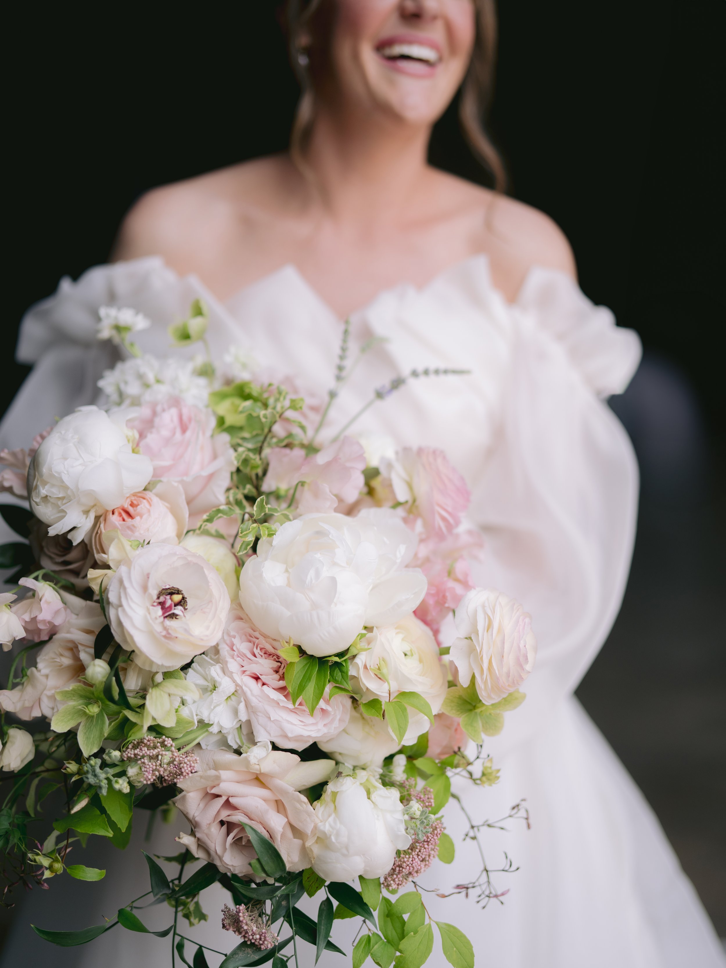 Organic bridal bouquet with Monique Lhuillier gown by luxury wedding photographer Amanda Watson