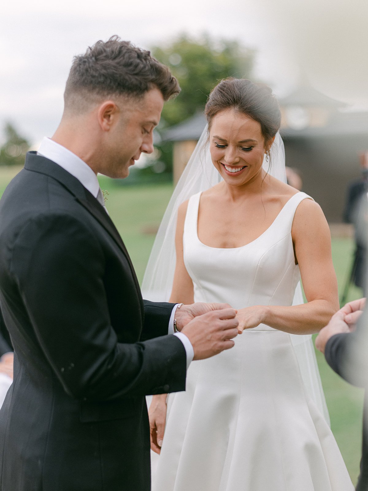 Intimate ring exchange by luxury wedding photographer Amanda Watson