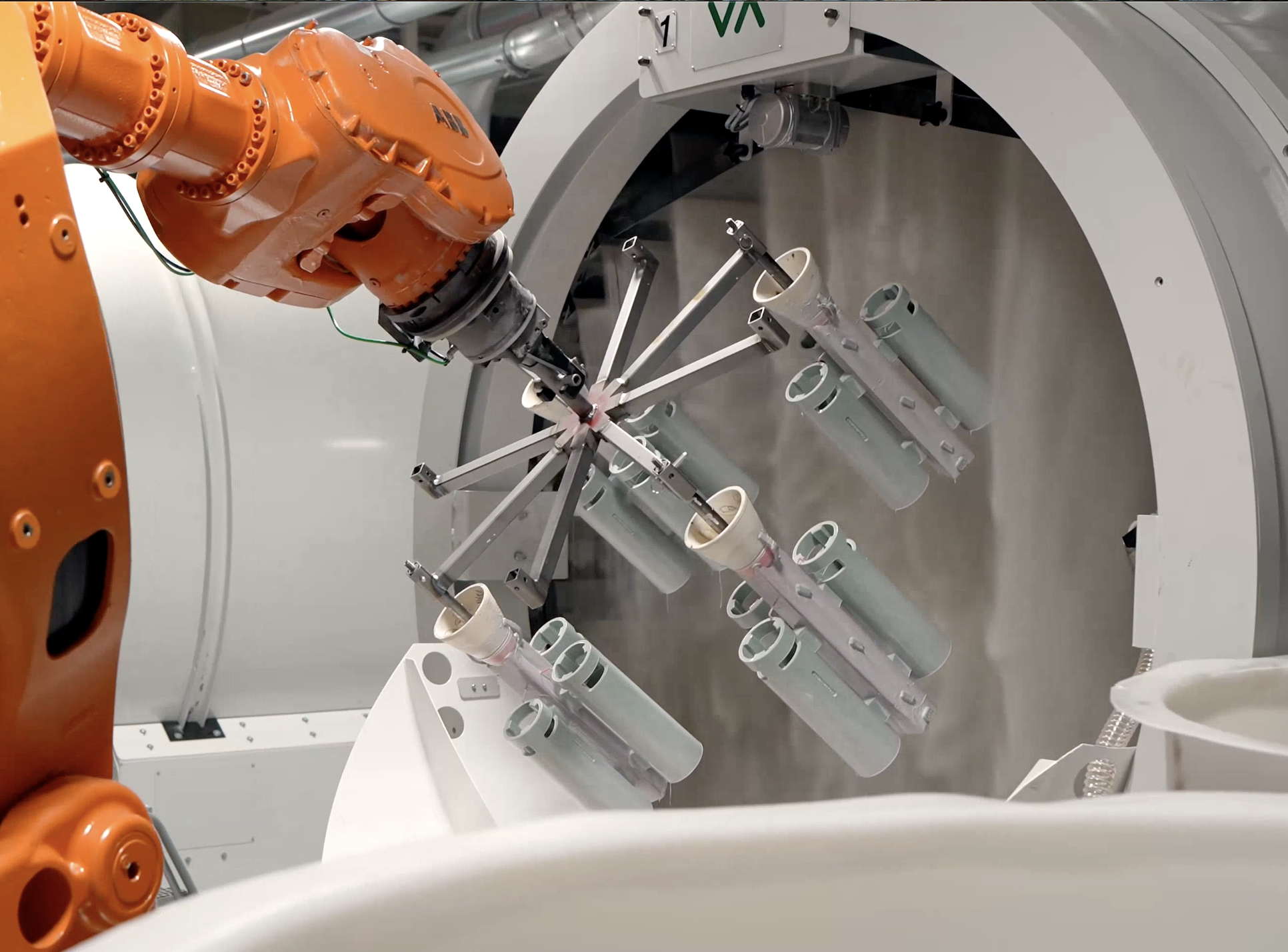 A rainfall sander adding ceramic coating to parts at IPC Foundry Group's Texas foundry.