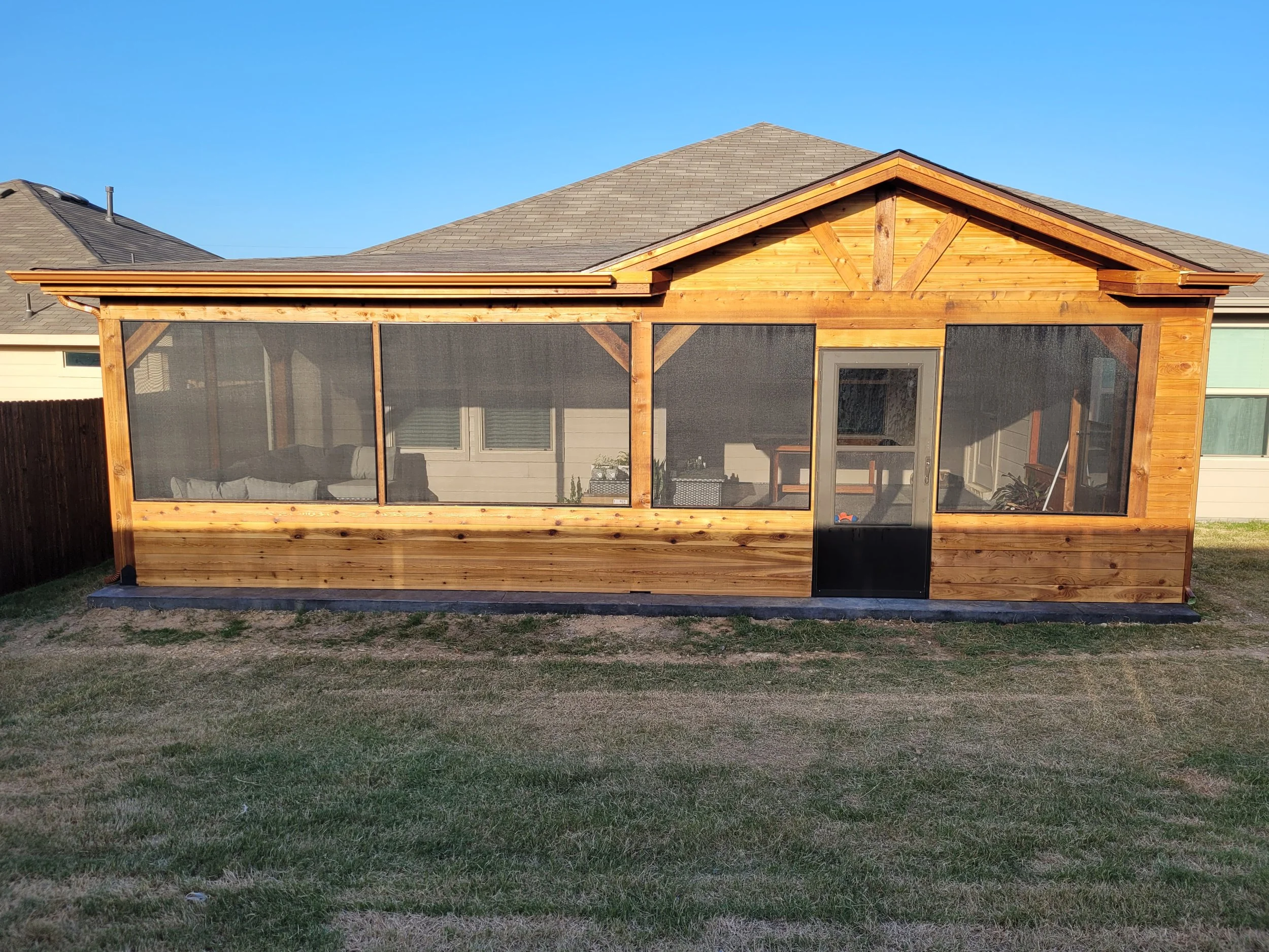 A newly built wooden screened enclosed patio