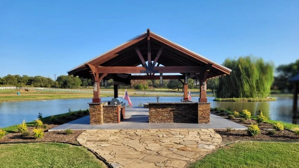 Detached patio with outdoor bbq area overlooking this families pond
