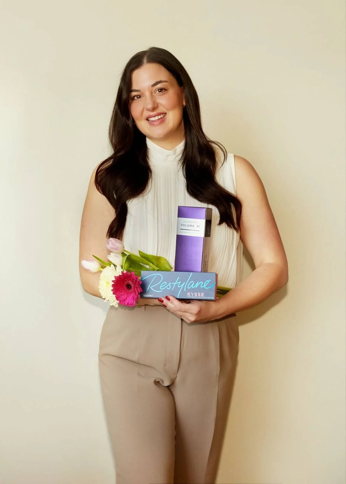 Injx Bar provider holding Juvederm dermal filler products used for lip and facial filler treatments near Peoria, AZ.