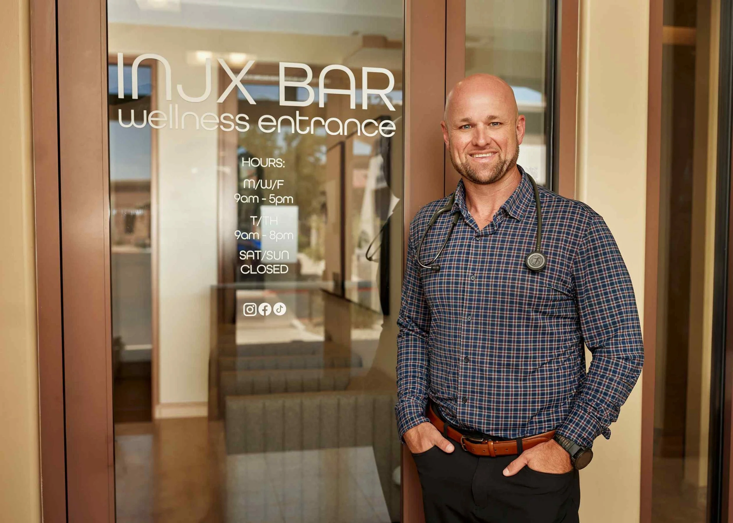Injx Bar wellness entrance sign, home of peptide therapy in Peoria, AZ.