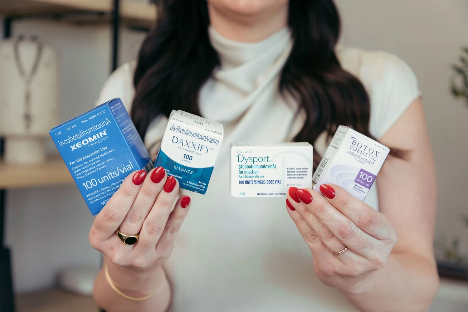 Injector holding xeomin, daxxify, dysport, botox products near me in the Peoria, AZ area.