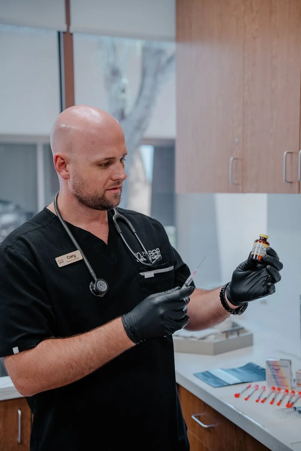 Medical provider holding up testosterone.