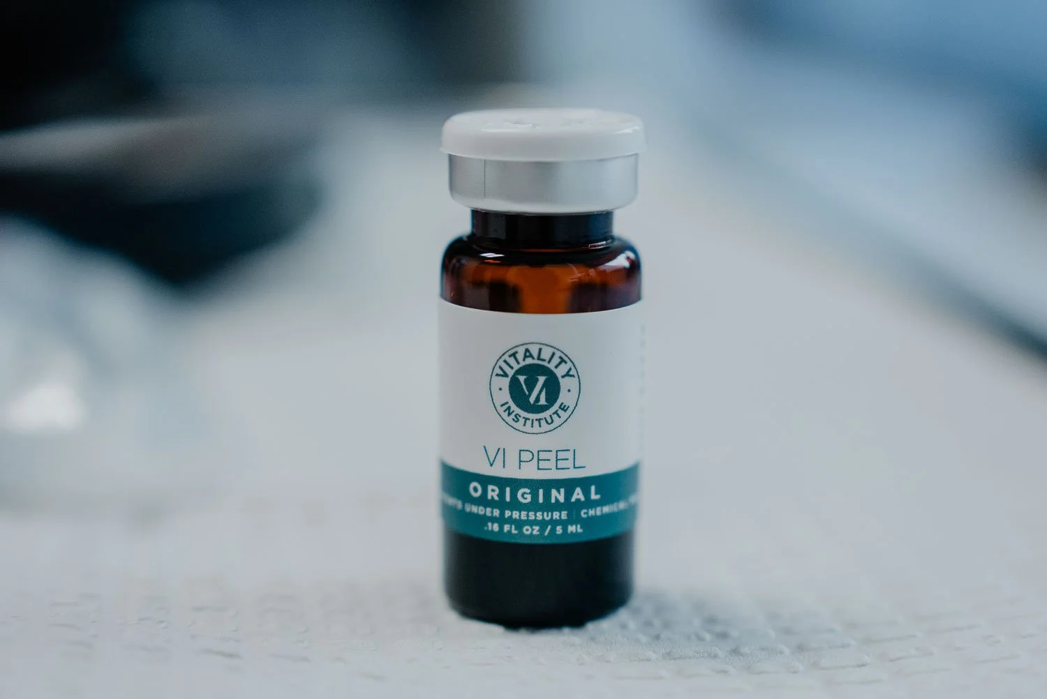 Small amber vial of VI Peel Original by Vitality Institute, a medical-grade chemical peel solution.