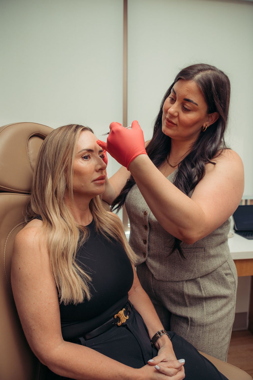 Provider and patient during a Daxxify appointment near Phoenix and Peoria, AZ — long-lasting neurotoxin results you'll love.