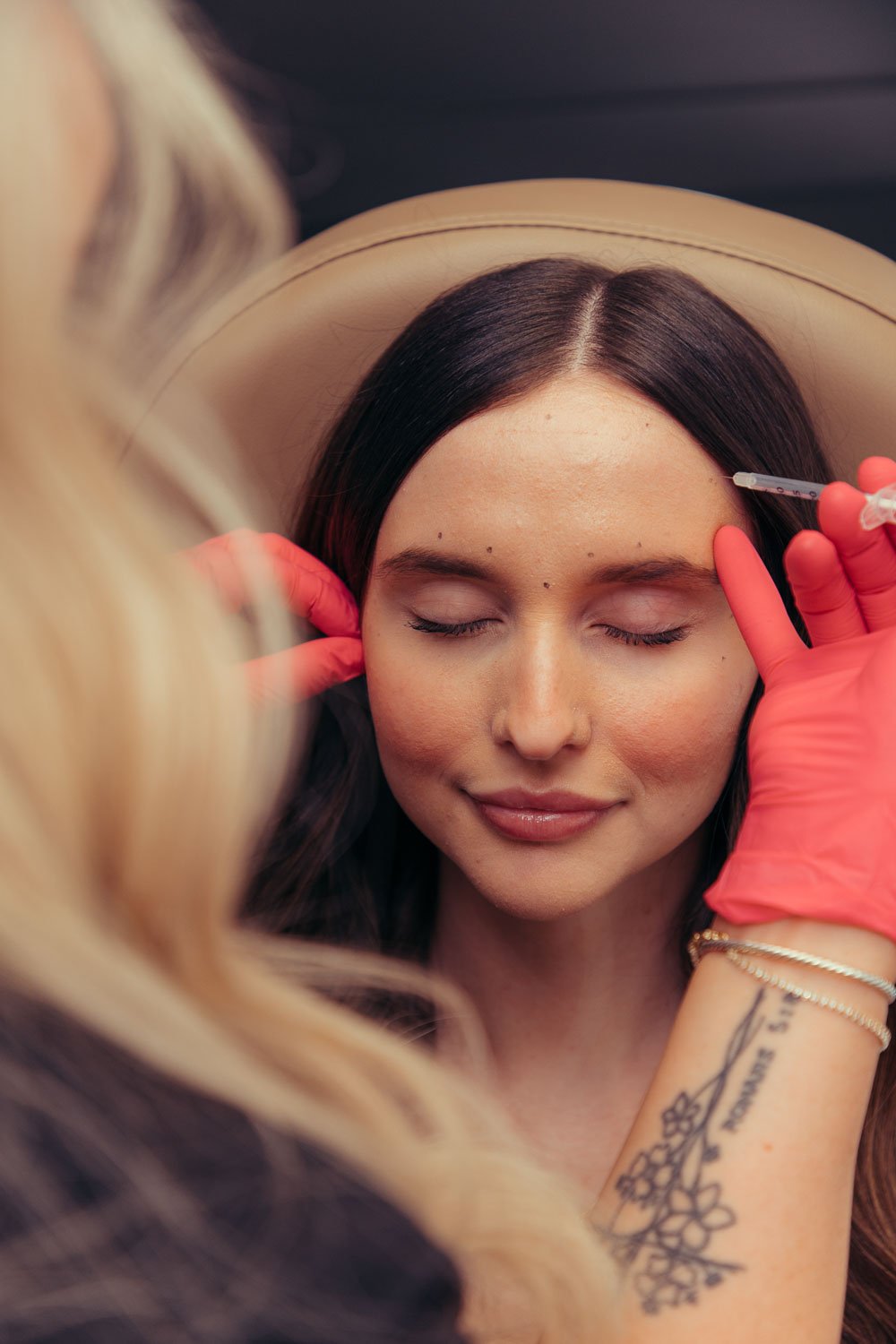Patient receiving a Daxxify injectable treatment, a peptide-powered neurotoxin alternative to Botox near Peoria, AZ.