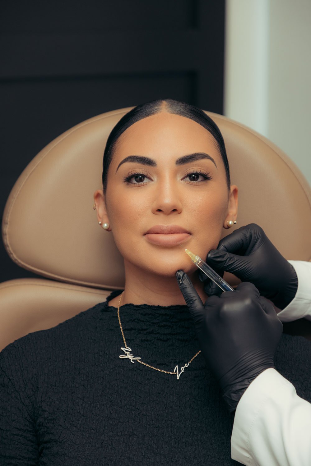 Patient receiving Daxxify neuromodulator treatment at a med spa.