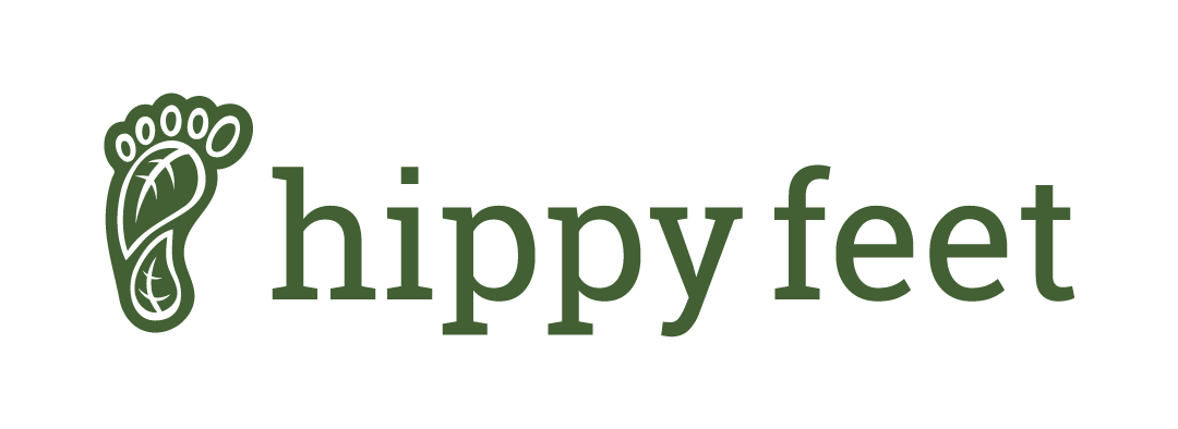 Logo with a green paw print and the words 'hippy feet' in green text
