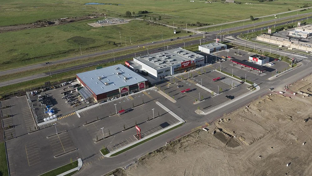 coop-buildings-and-parking-lot-complex-elan-construction.jpeg