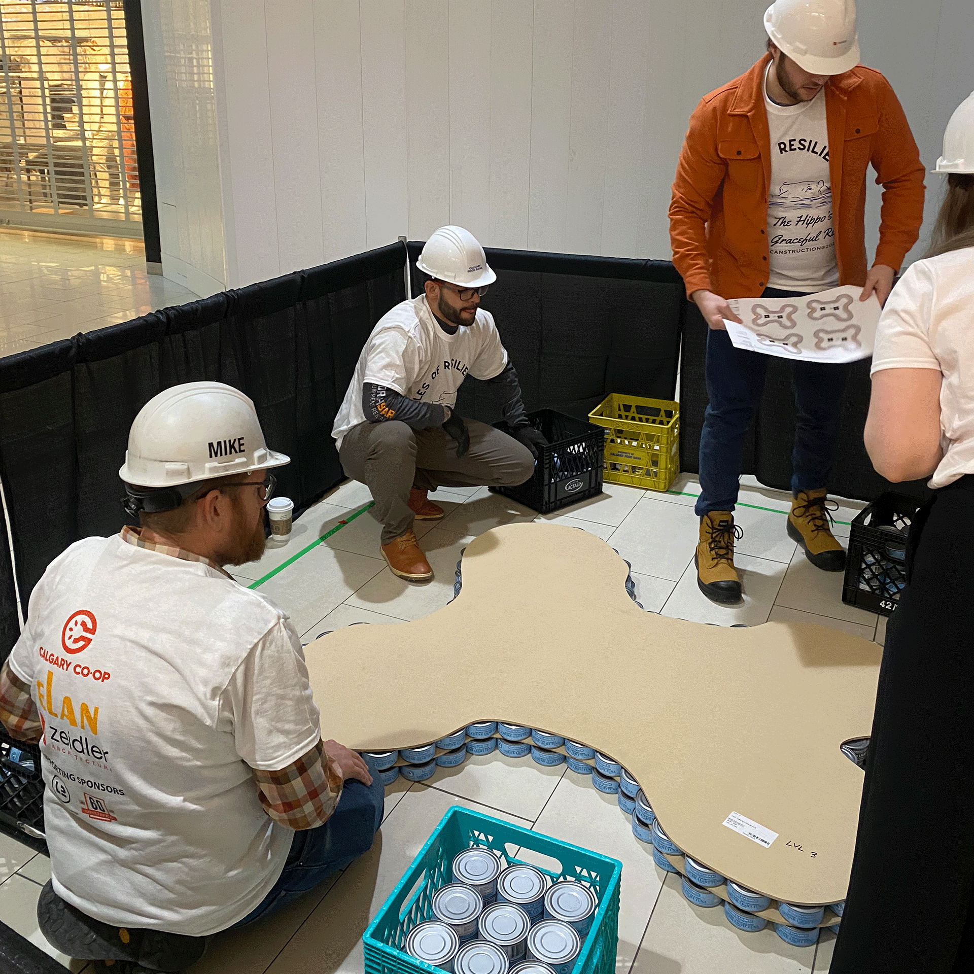 calgary-food-bank-canstruction-2025-elan-construction-team-work2.png