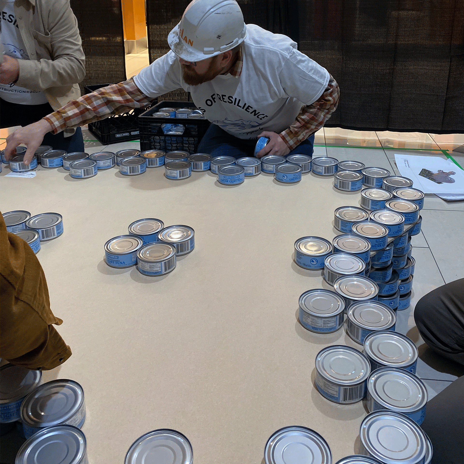 calgary-food-bank-canstruction-2025-elan-construction-team-work.png