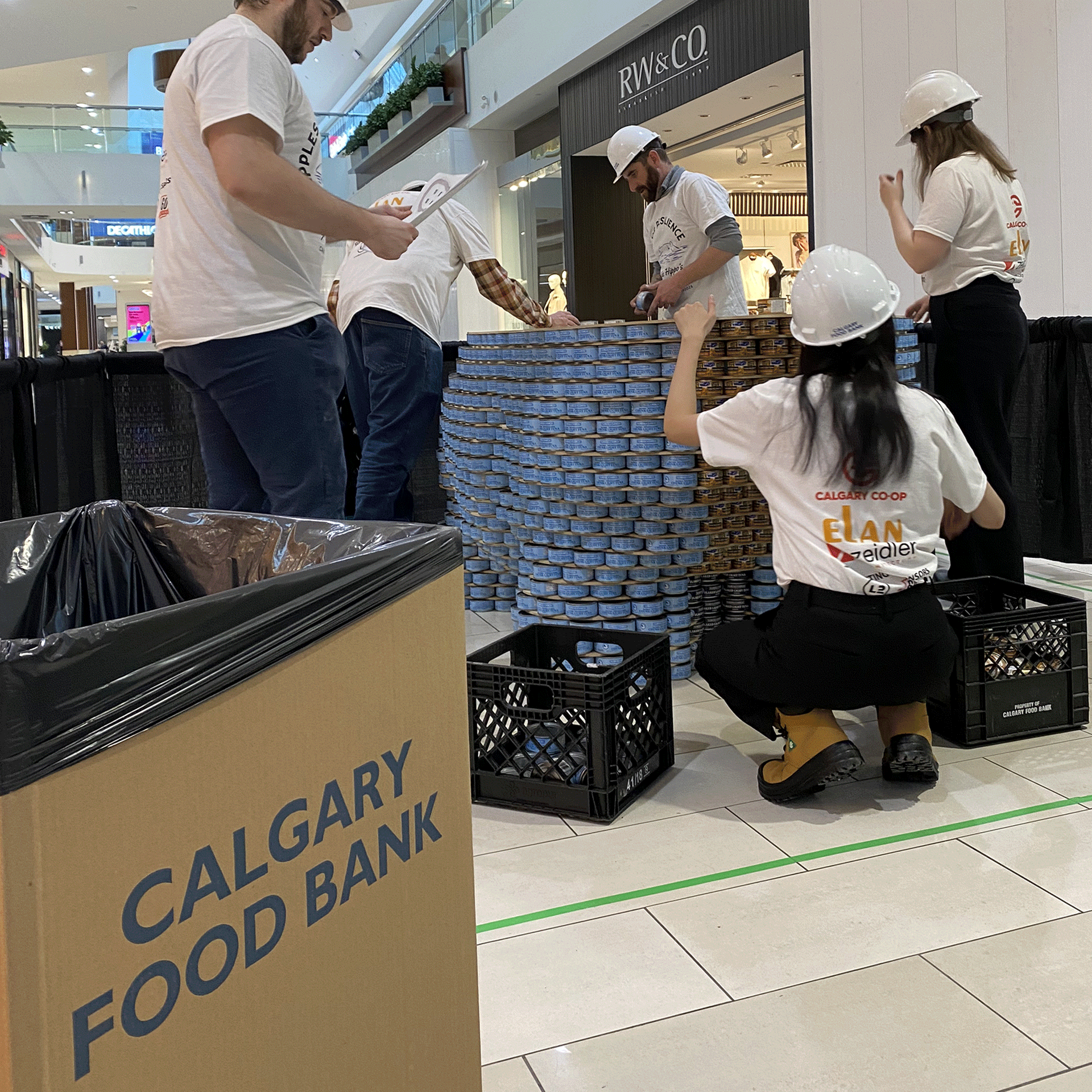 calgary-food-bank-canstruction-2025-elan-construction-team-work1.png
