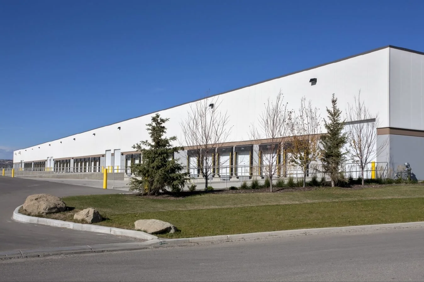 A long white building with transport shipping doors