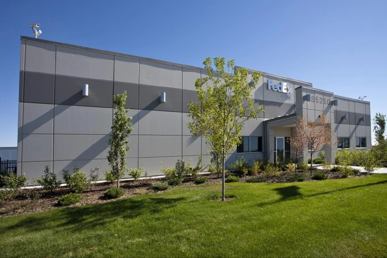 The fedex building with a green lawn