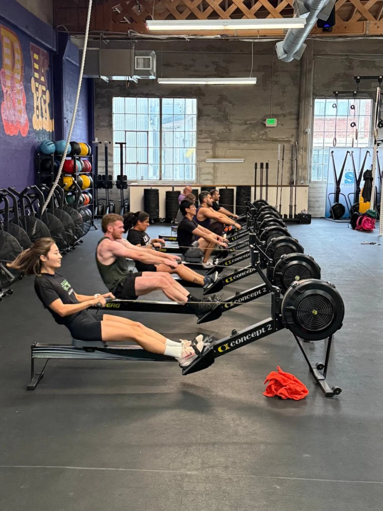 Together.

For time:
50 pull-ups
50 hang squat cleans (65/95 lb)
50-cal row
