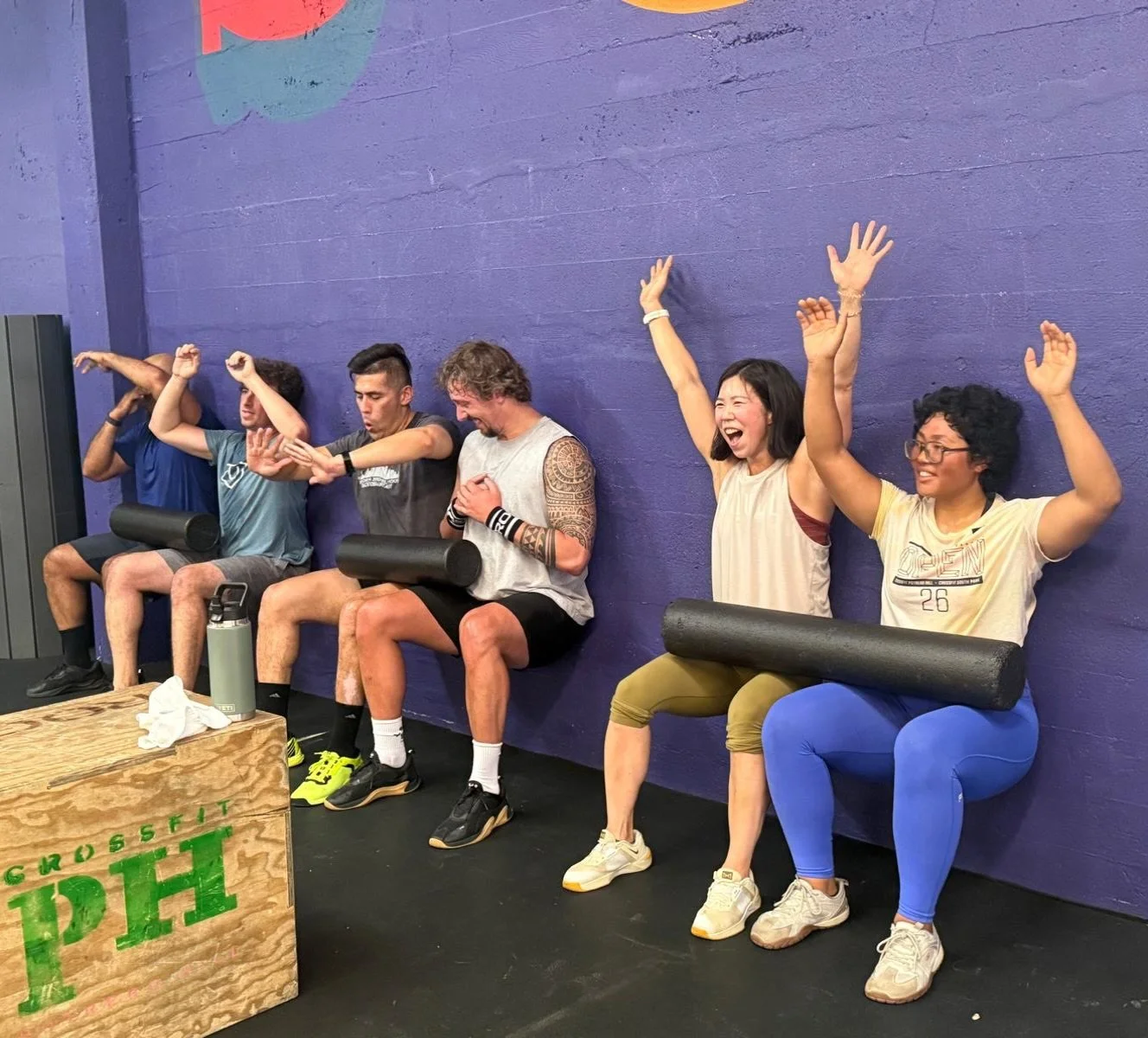 Partner challenge: keep the wall sit hold, don&rsquo;t drop the foam roller. 🔥