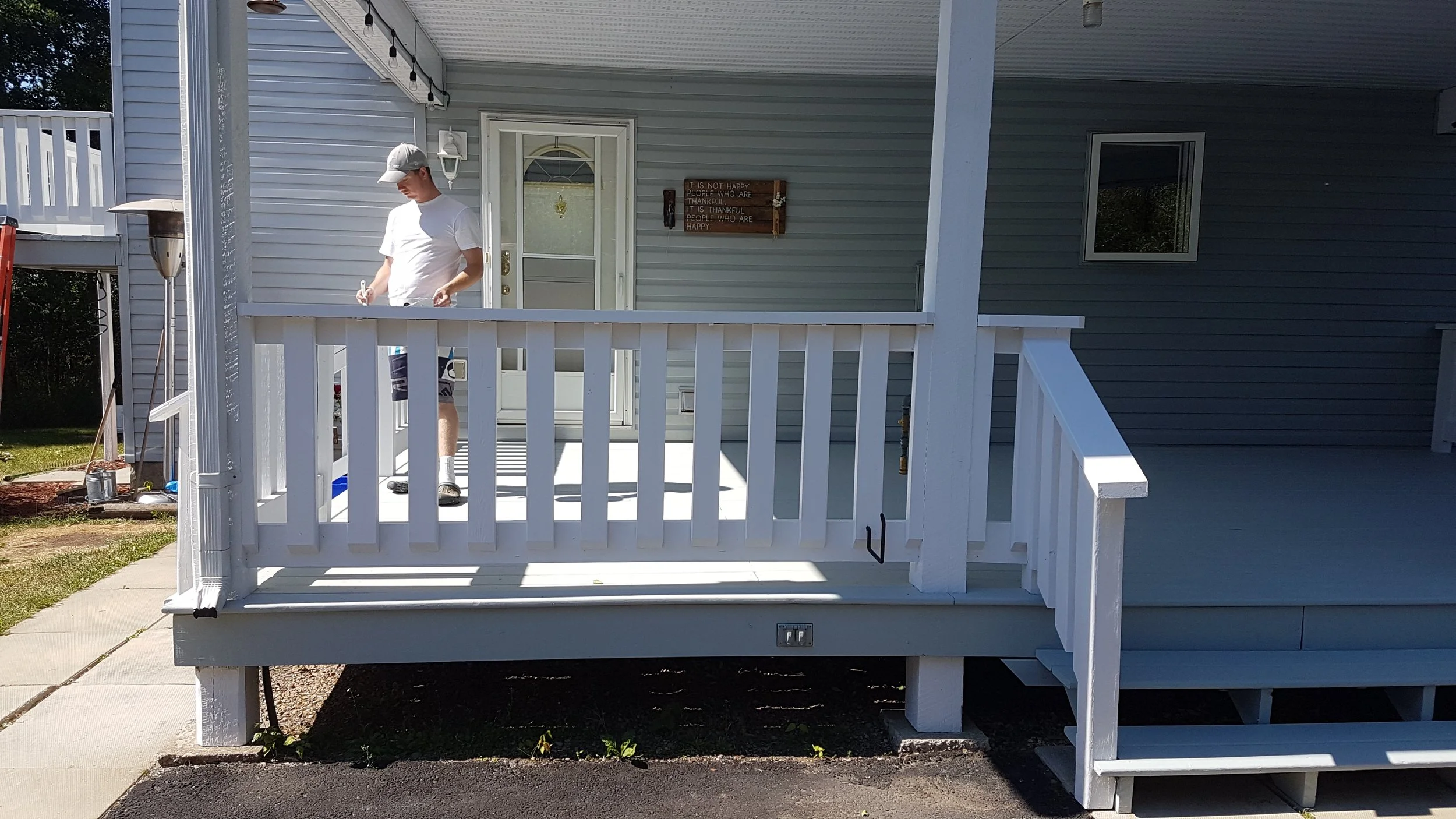 Me painting a deck.jpg