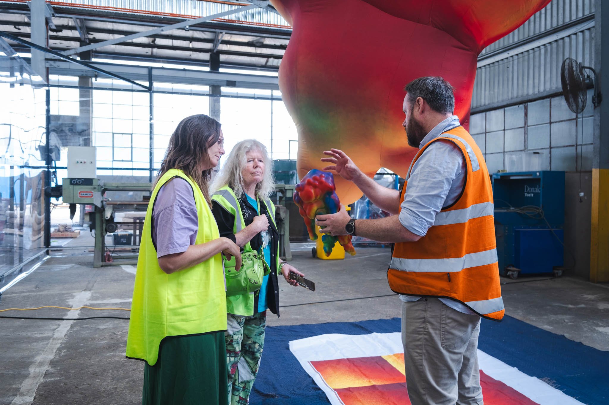Judy Darragh and UAP Team Brisbane with Ether Sample. Image Courtesy of UAP | Urban Art Projects