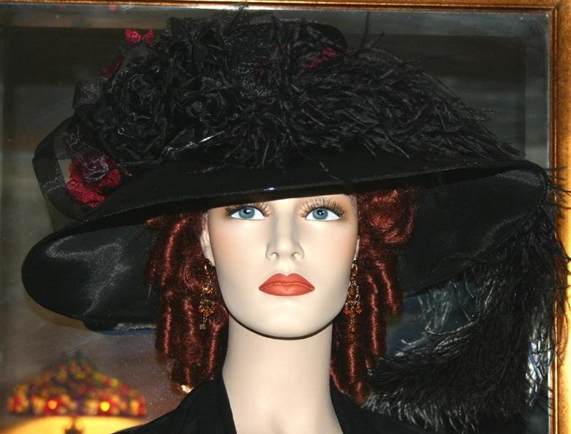 Black Organza wide brim hat adorned with lace, roses, and feathers.
