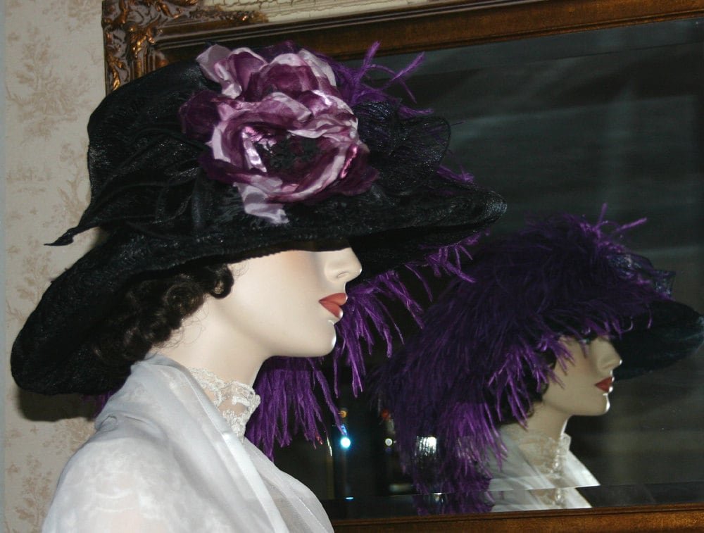 Black organza hat sideview showing the millinery roses in eggplant.