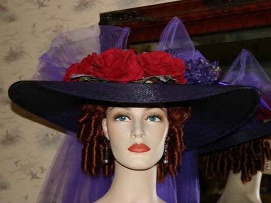 Purple wide brim Southern Belle Hat accented with red roses.