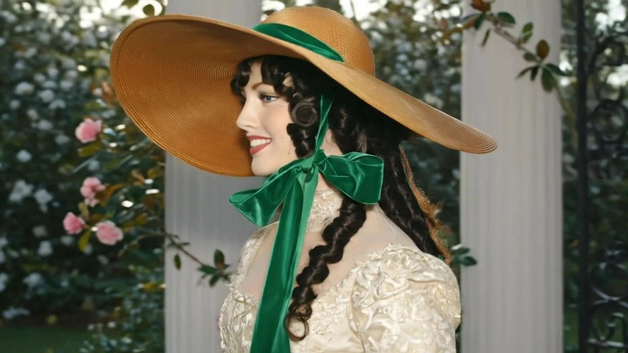 Sideview of Gone with the Wind Southern Belle Hat in a designer straw color with green ribbon ties.