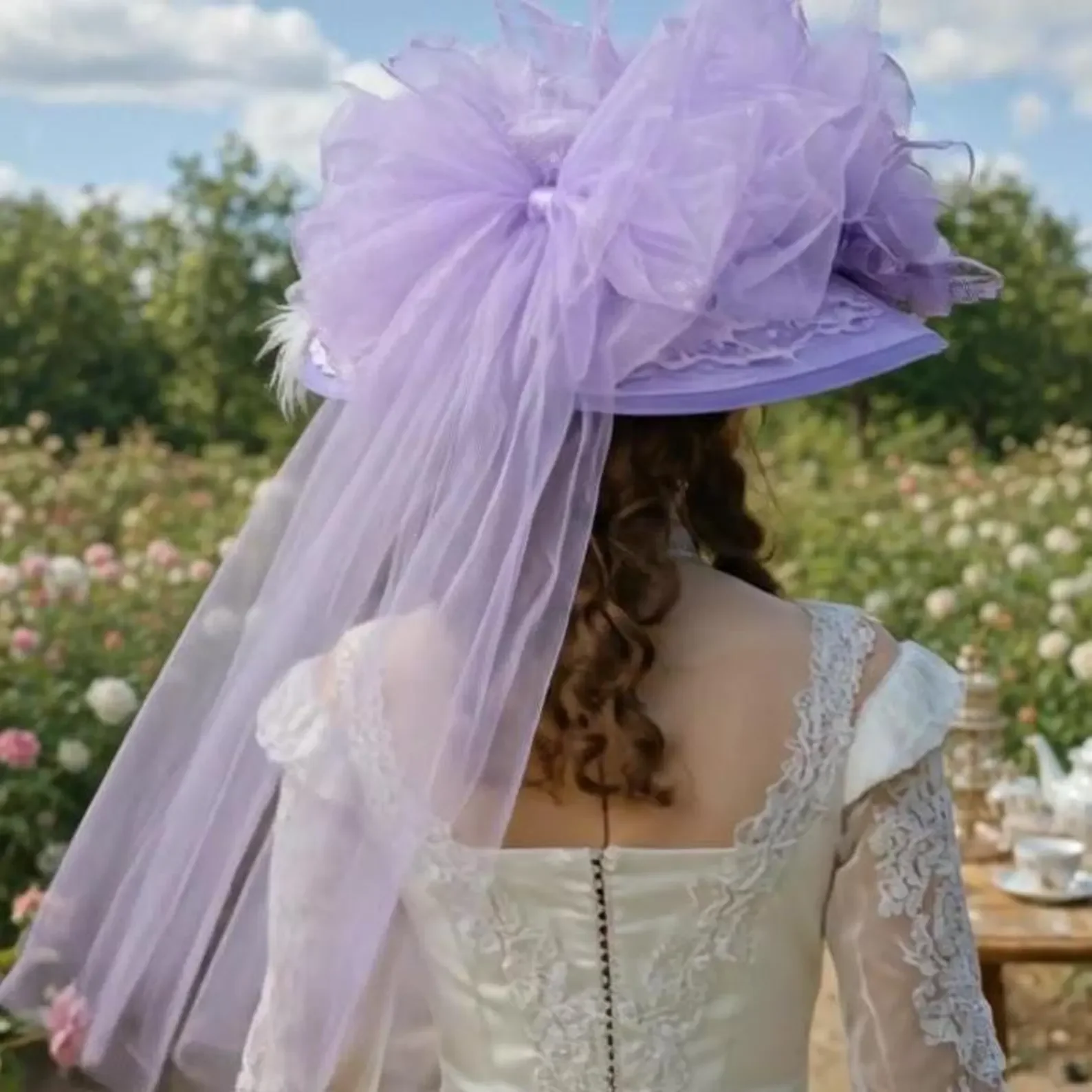 Lavender tulle bow on the back of a Victorian Tea hat.