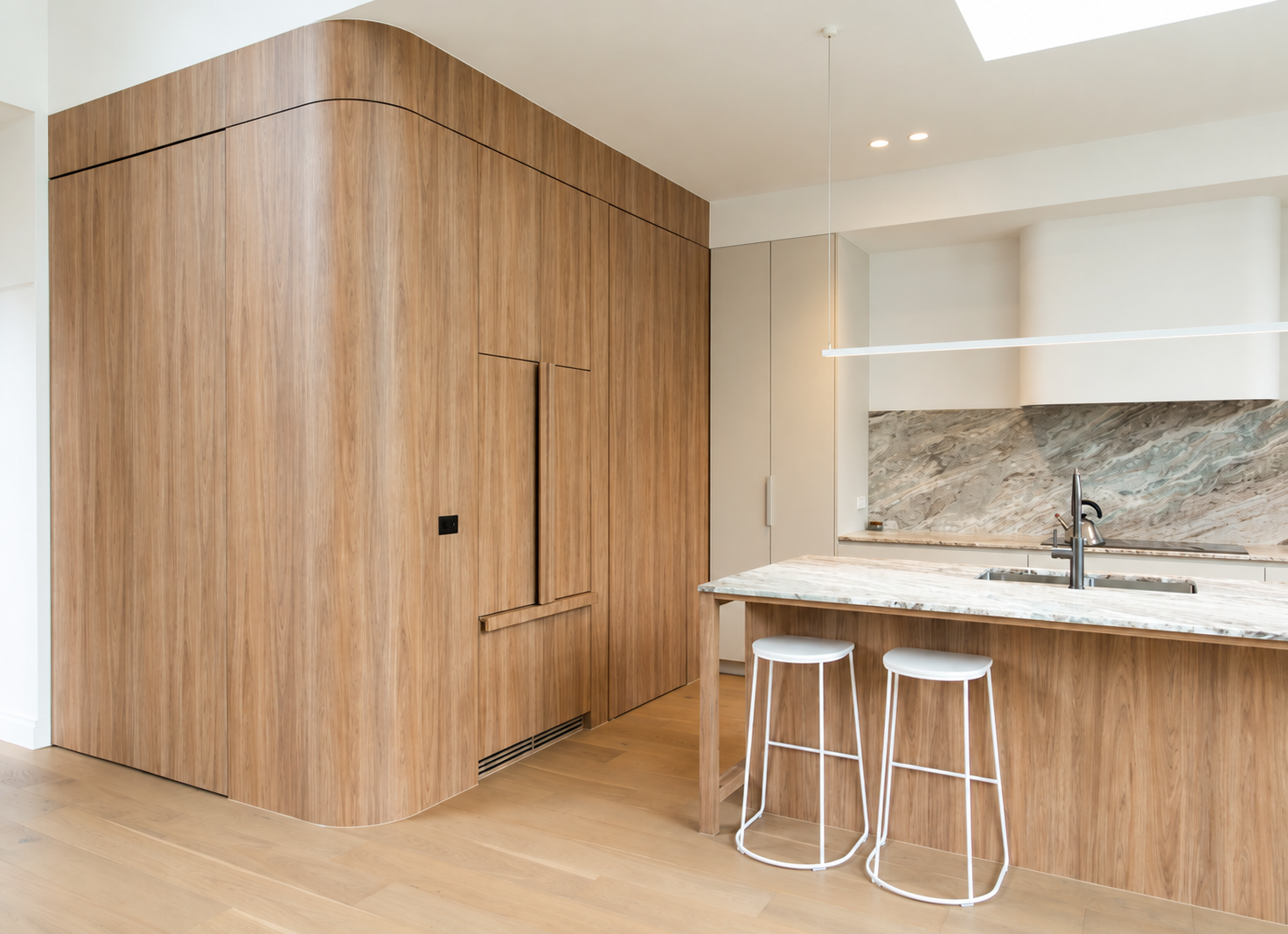 Curved timber veneer joinery and kitchen by Build One and ARKO Joinery, Melbourne