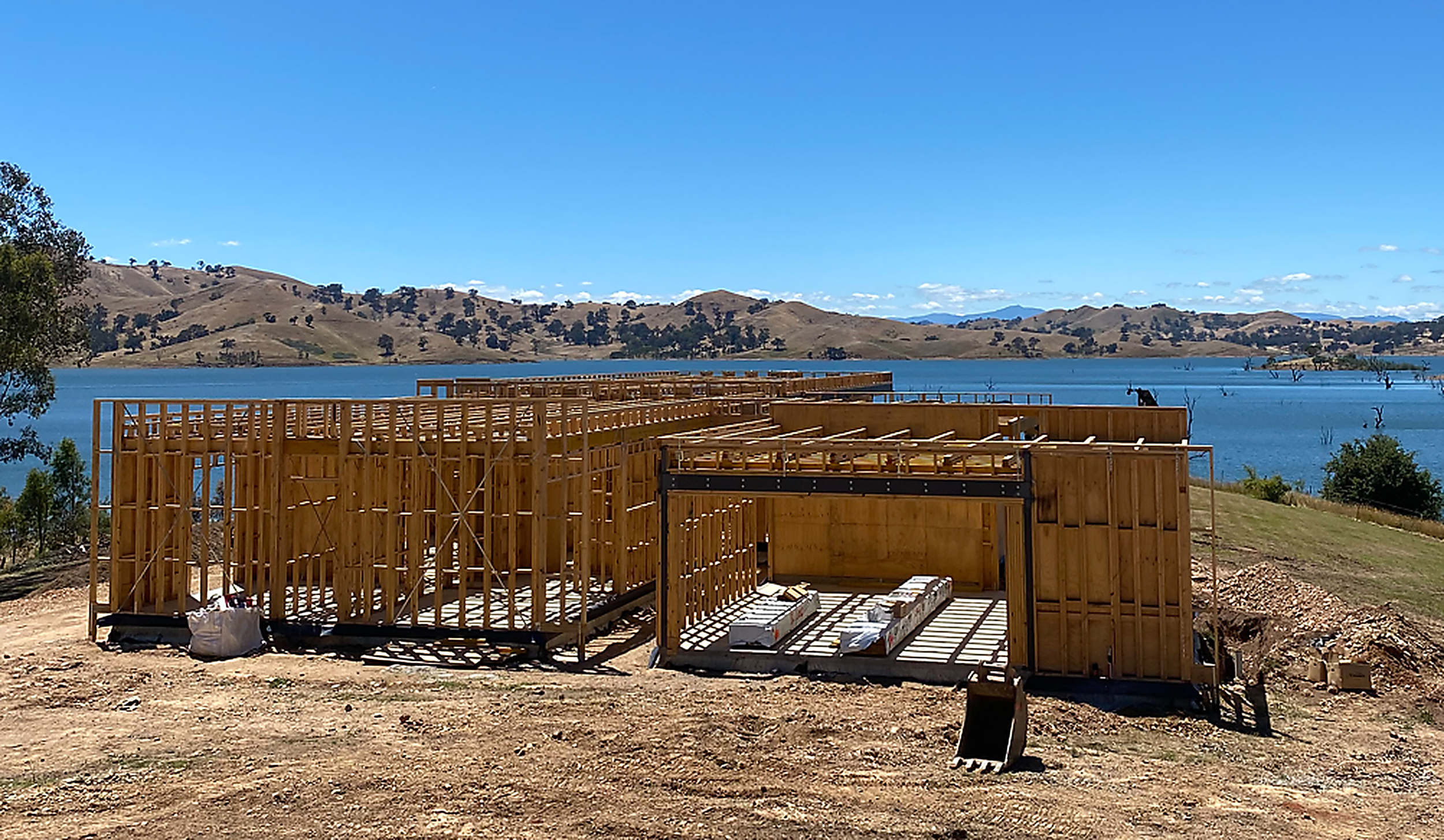 Lakeside architect-designed custom home at frame stage, built by Build One Design & Construction