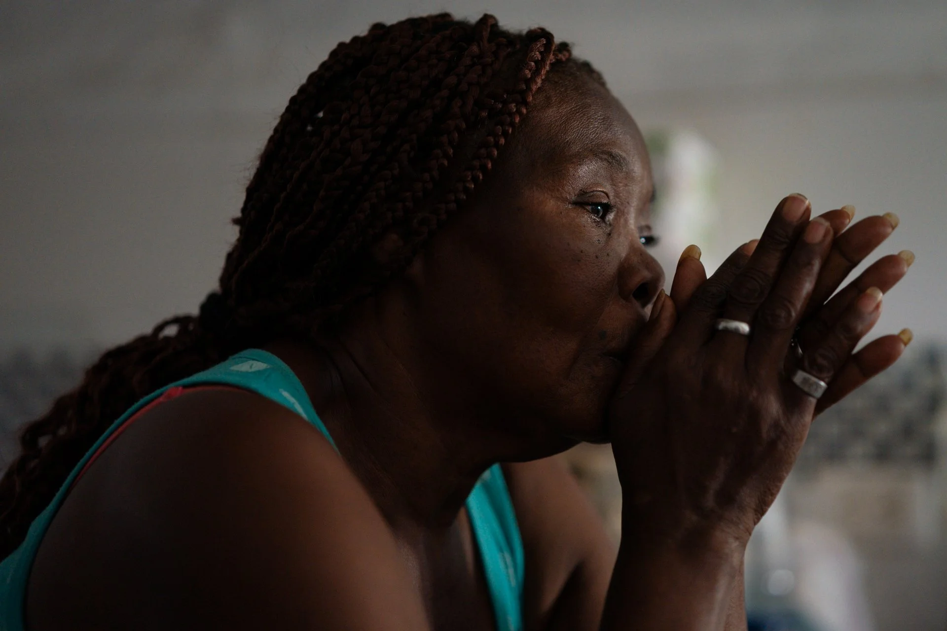 Felicia Valdez, grandmother of Steven Medina, silently watches over her grandson’s coffin during the wake at her home in the Las Malvinas neighborhood.