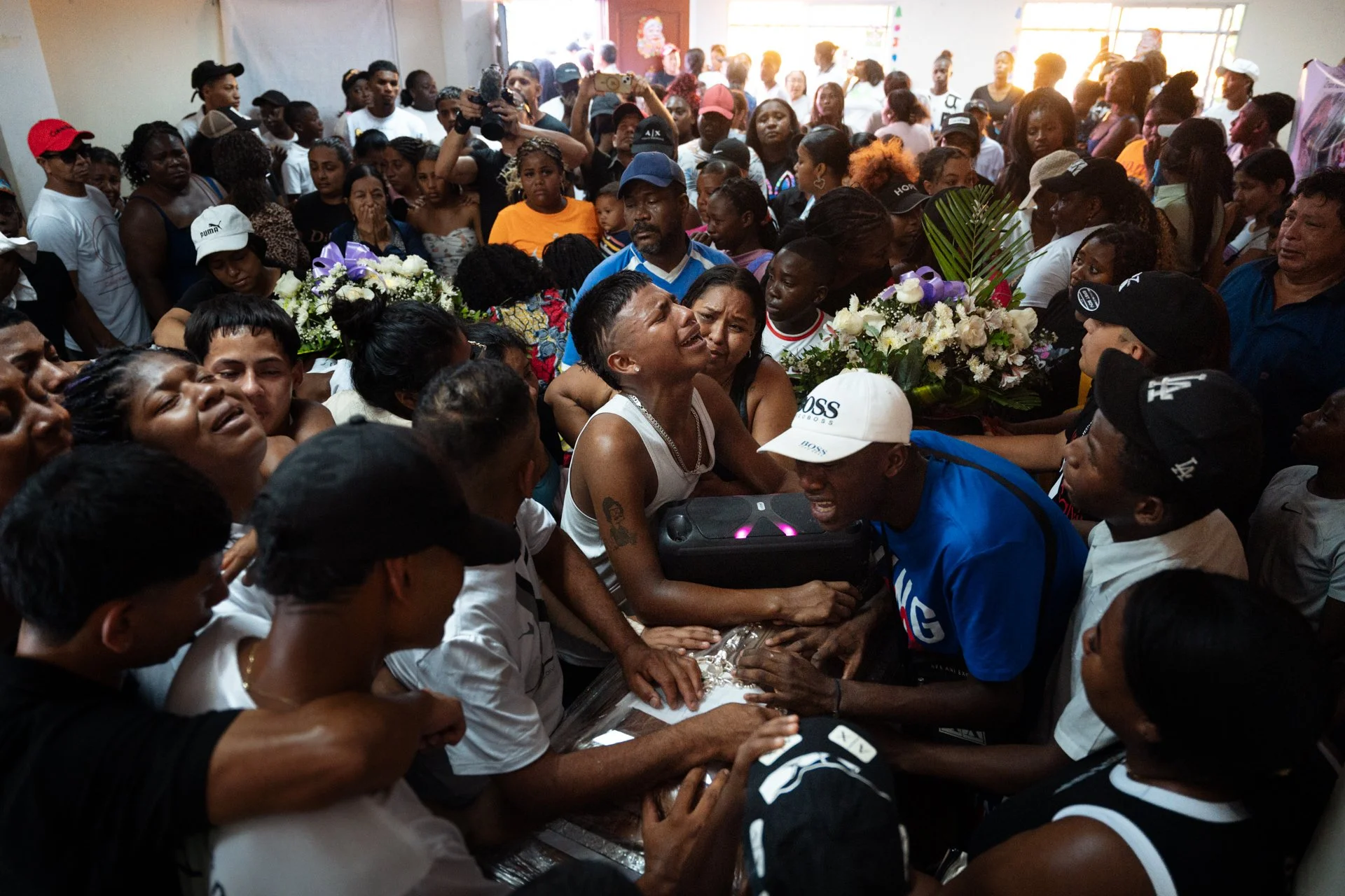 Friends and relatives bid farewell amid cries and tears during the joint wake of the four boys at the community hall in the Las Malvinas neighborhood, in southern Guayaquil. The bodies were laid to rest on January 1, 2025, one day after the Attorney 